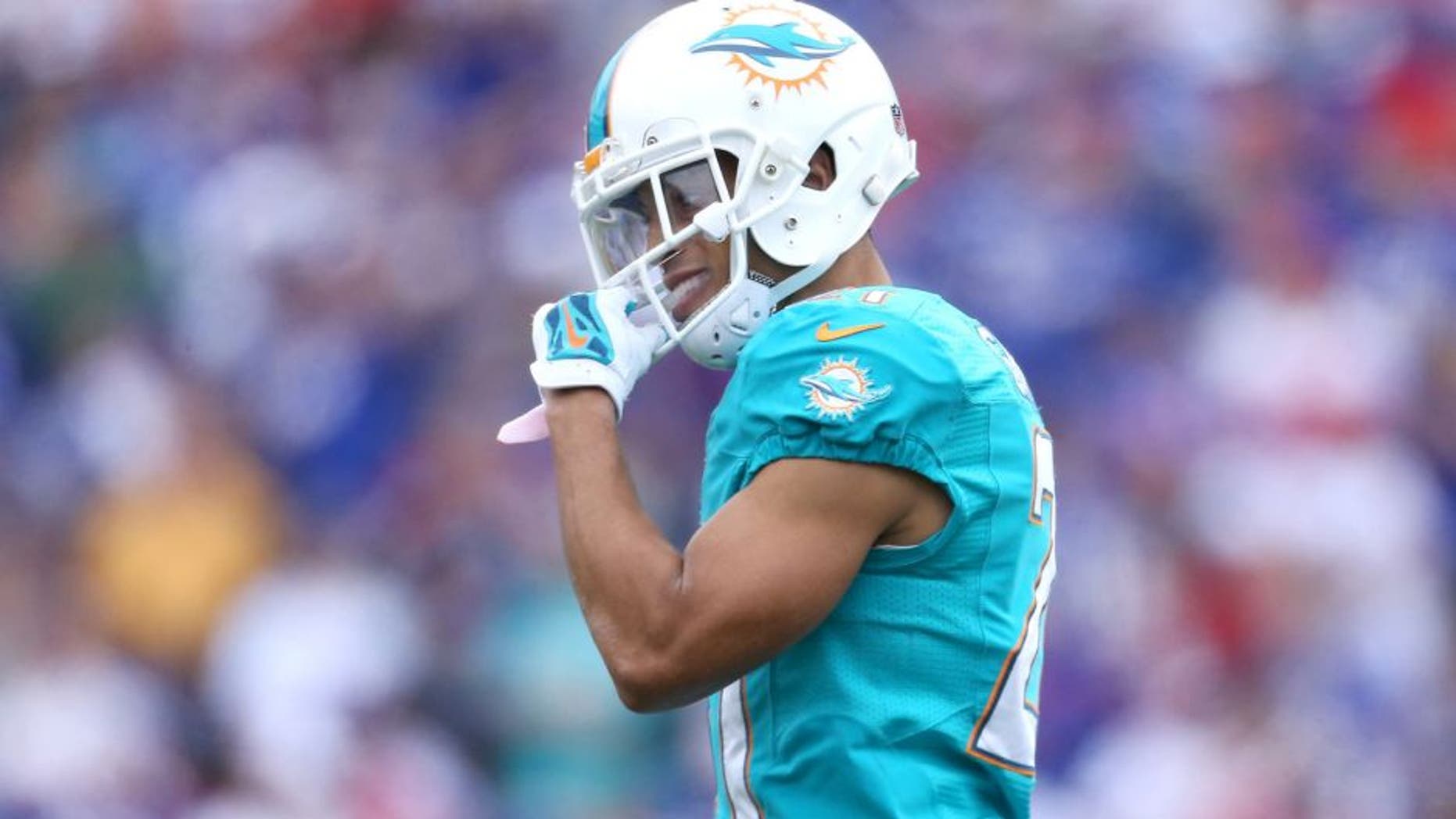 ORCHARD PARK, NY - SEPTEMBER 14: Brent Grimes #21 of the Miami Dolphins during NFL game action against the Buffalo Bills at Ralph Wilson Stadium on September 14, 2014 in Orchard Park, New York. (Photo by Tom Szczerbowski/Getty Images)
