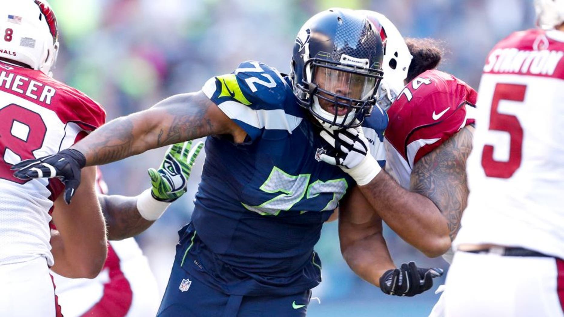 Nov 23, 2014; Seattle, WA, USA; Seattle Seahawks defensive end Michael Bennett (72) rushes the passer against the Arizona Cardinals during the second quarter at CenturyLink Field. Mandatory Credit: Joe Nicholson-USA TODAY Sports