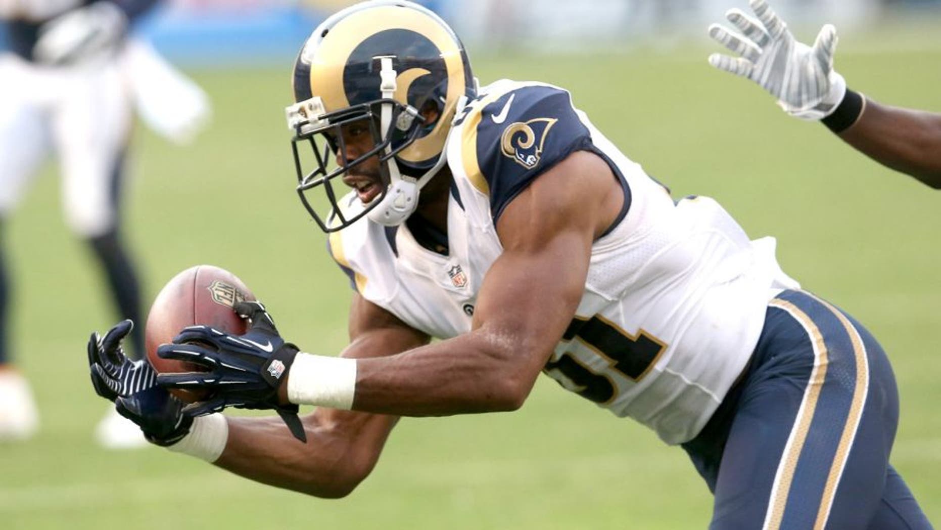 SAN DIEGO, CA - NOVEMBER 23: Kenny Britt #81 of the St. Louis Rams makes a catch down to the six yard line with a minute fifteen seconds left against the San Diego Chargers at Qualcomm Stadium on November 23, 2014 in San Diego, California. The Chargers won 27-24. (Photo by Stephen Dunn/Getty Images)