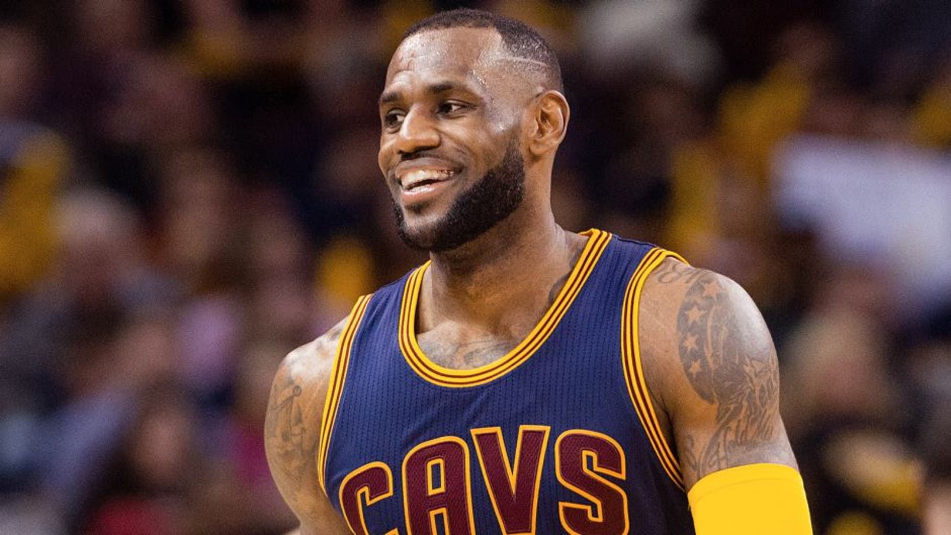 CLEVELAND, OH - APRIL 5: LeBron James #23 of the Cleveland Cavaliers smiles to the fans during the second half against the Chicago Bulls at Quicken Loans Arena on April 5, 2015 in Cleveland, Ohio. The Cavaliers defeated the Bulls 99-94. NOTE TO USER: User expressly acknowledges and agrees that, by downloading and or using this photograph, User is consenting to the terms and conditions of the Getty Images License Agreement. (Photo by Jason Miller/Getty Images)