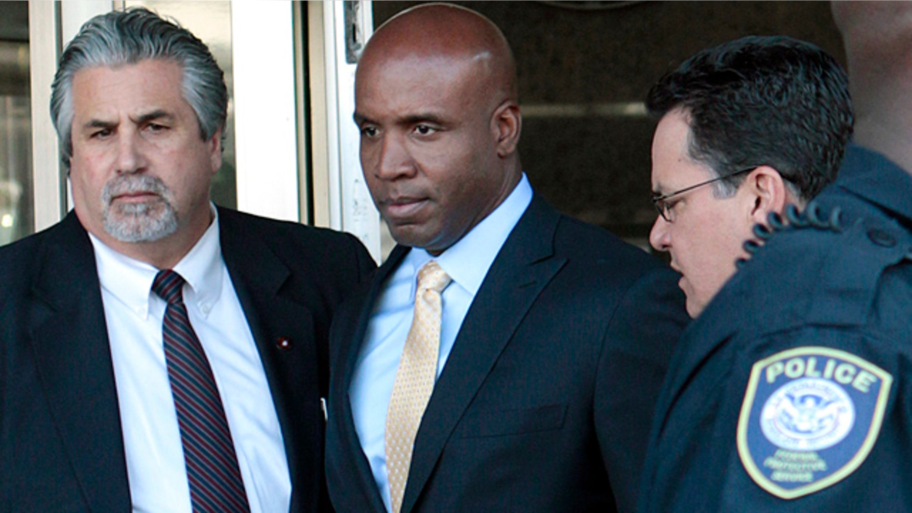 April 7: Former baseball player Barry Bonds, center, leaves federal court in San Francisco.