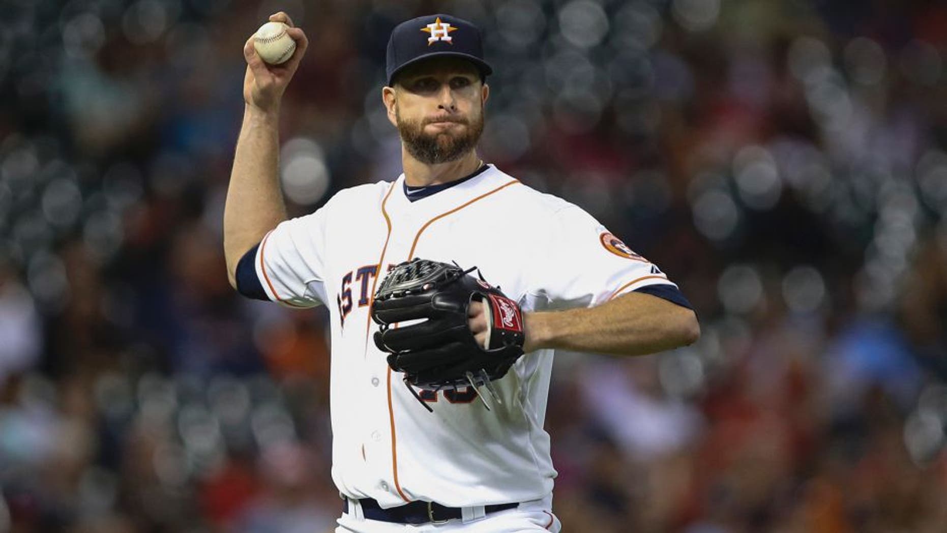 Apr 8, 2015; Houston, TX, USA; Houston Astros starting pitcher Scott Feldman (46) throws out a runner at first base during the fifth inning against the Cleveland Indians at Minute Maid Park. Mandatory Credit: Troy Taormina-USA TODAY Sports