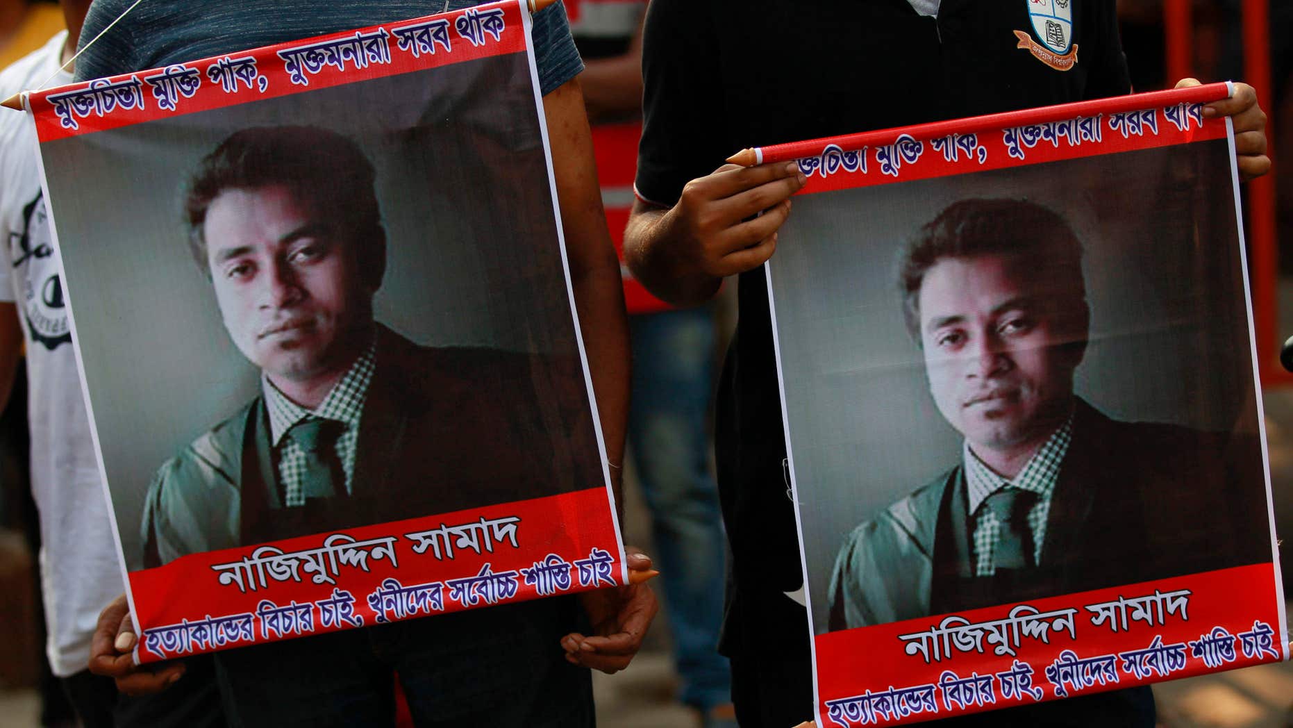 April 8, 2016: People carry portraits of student activist Nazimuddin Samad as they attend a rally to demand arrest of three motorcycle-riding assailants who hacked and shot Samad to death, in Dhaka, Bangladesh.