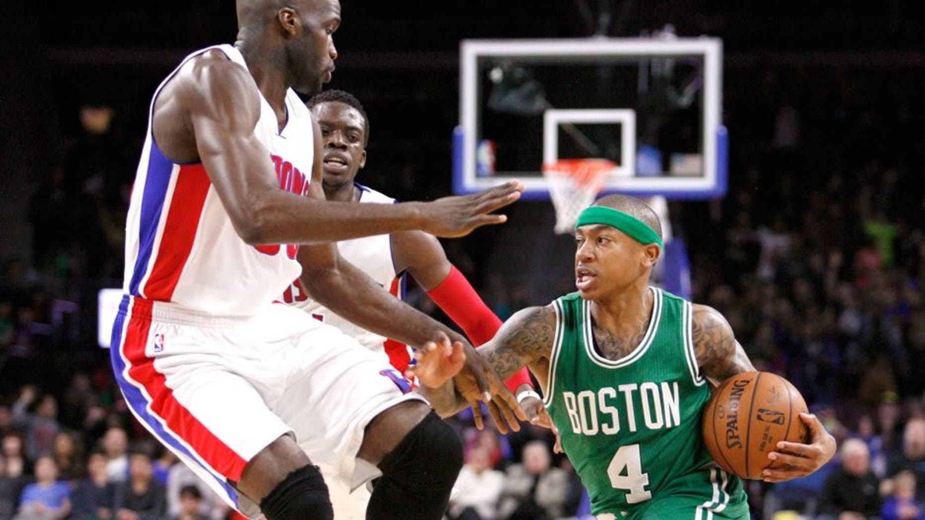 Apr 8, 2015; Auburn Hills, MI, USA; Boston Celtics guard Isaiah Thomas (4) dribbles the ball as Detroit Pistons center Joel Anthony (50) and guard Reggie Jackson (1) defend during the second quarter at The Palace of Auburn Hills. The Celtics won 113-103. Mandatory Credit: Raj Mehta-USA TODAY Sports