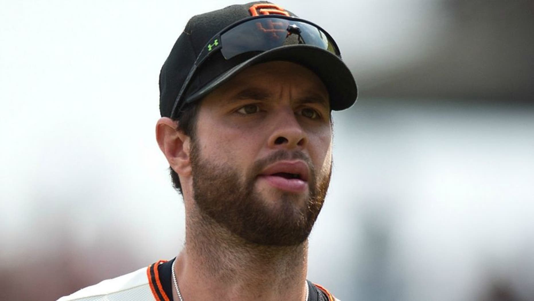 Brandon Belt #9 of the San Francisco Giants returns to the dugout during the fourth inning against the San Diego Padres at AT&T Park on September 13, 2015 in San Francisco, California. The San Francisco Giants defeated the San Diego Padres 10-3. (Photo by Jason O. Watson/Getty Images)