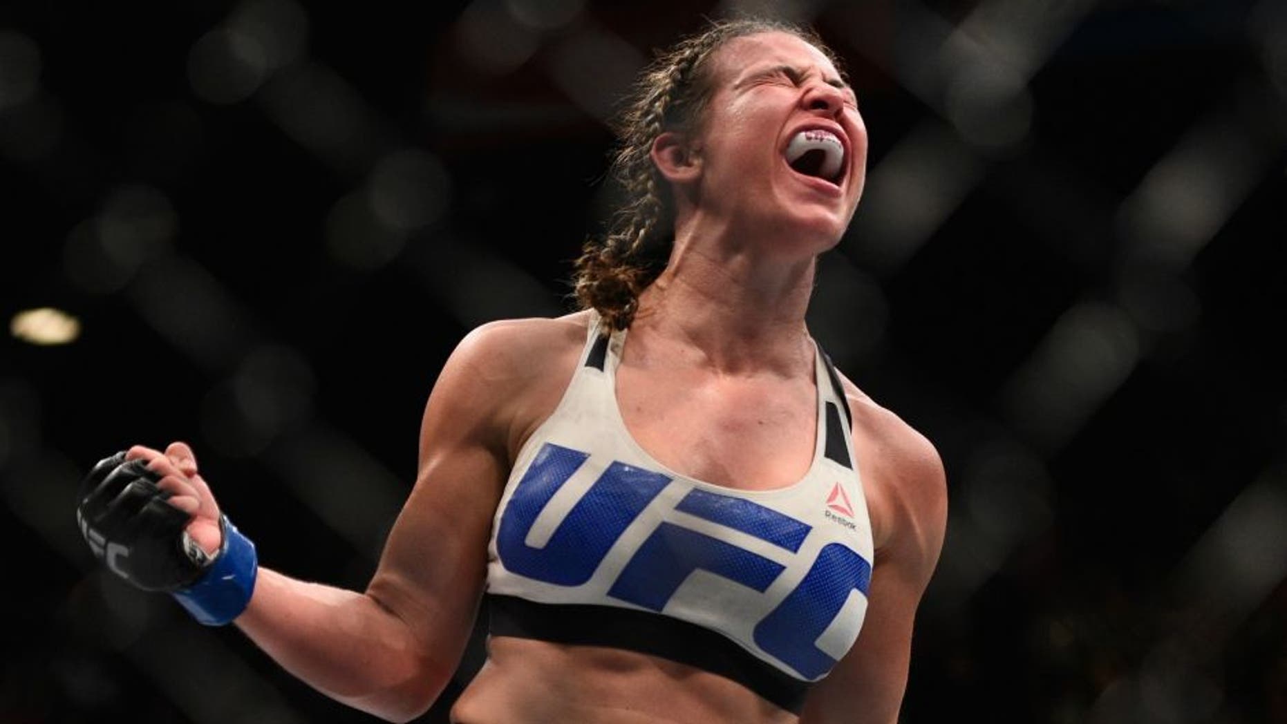 Miesha Tate celebrates after defeating Holly Holm during the UFC 196 event inside MGM Grand Garden Arena on March 5, 2016 in Las Vegas, Nevada. (Photo by Jeff Bottari/Zuffa LLC/Zuffa LLC via Getty Images)