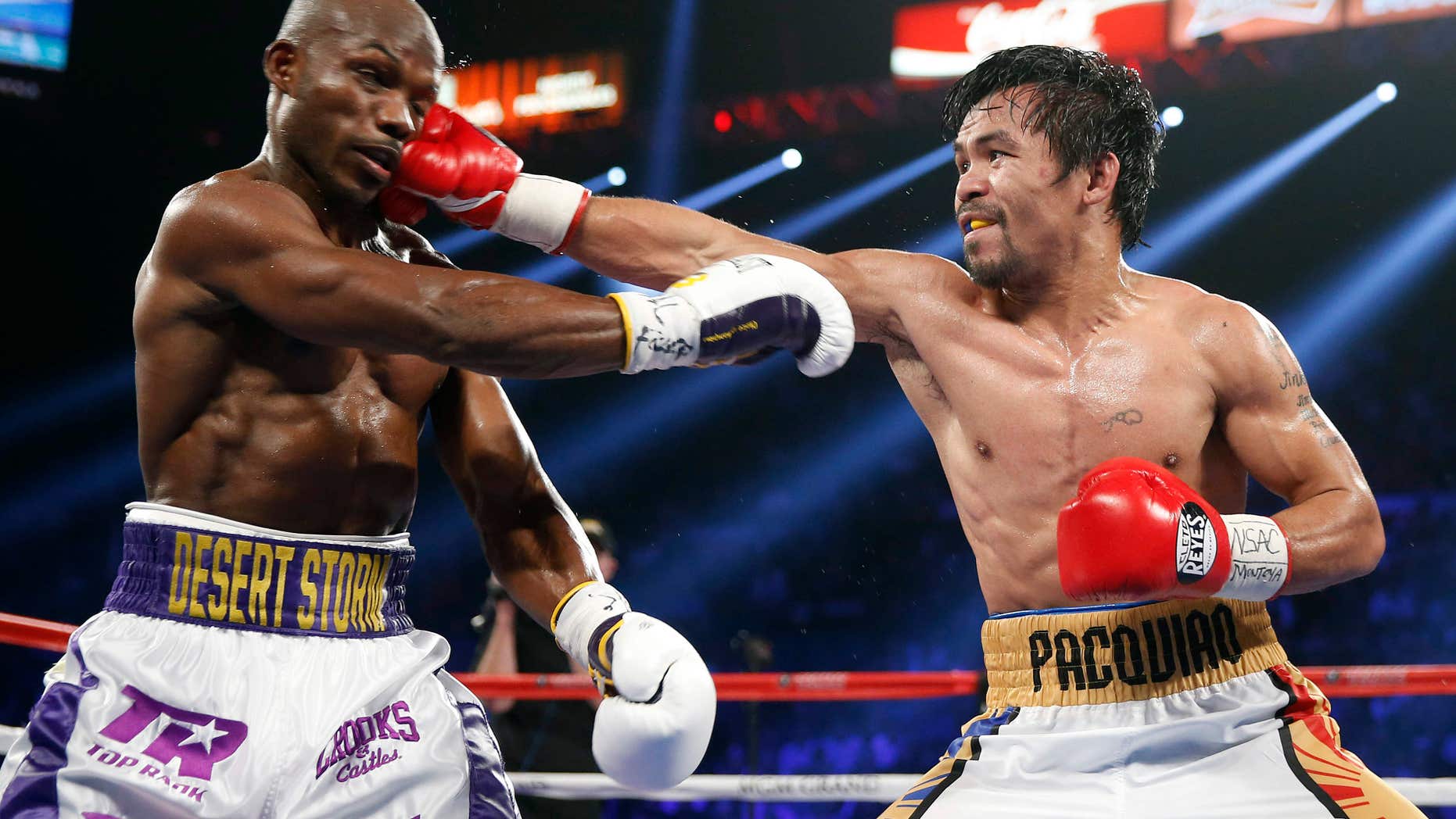 Manny Pacquiao, right, of the Philippines, hits Timothy Bradley during their WBO welterweight title boxing bout Saturday, April 9, 2016, in Las Vegas.