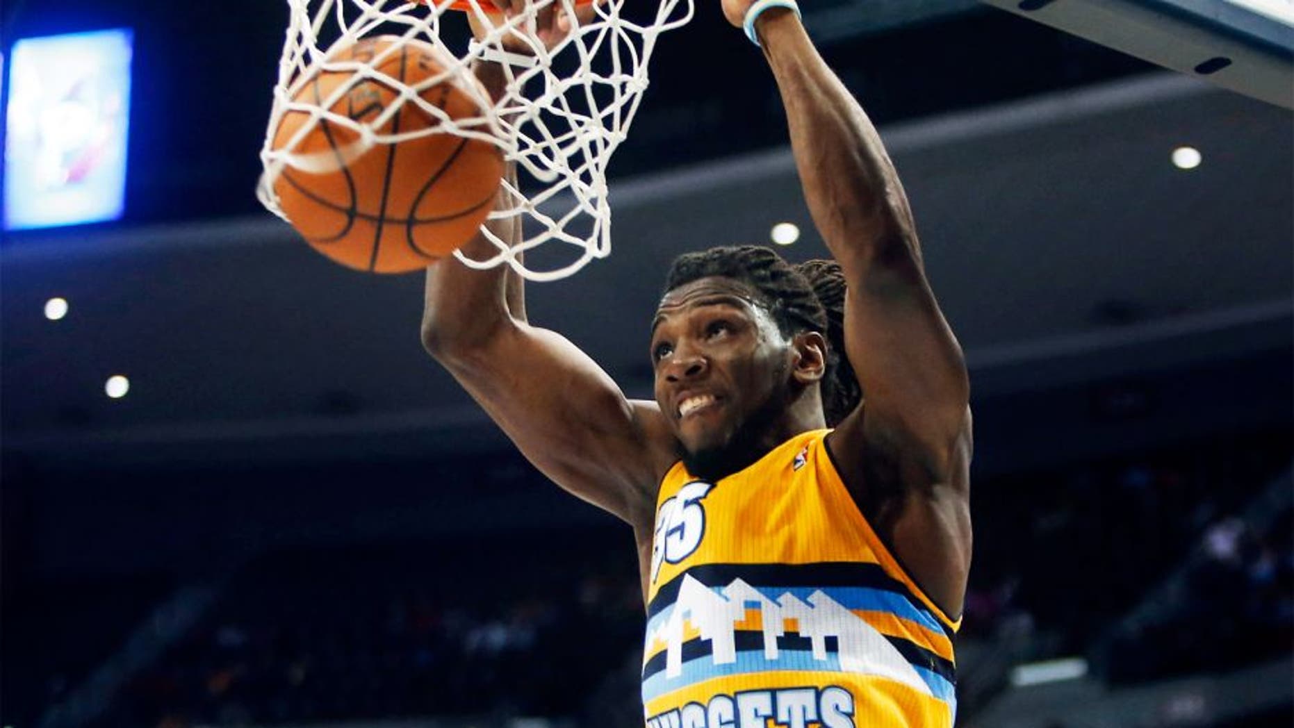 Apr 2, 2014; Denver, CO, USA; Denver Nuggets forward Kenneth Faried (35) dunks the ball during the second half against the New Orleans Pelicans at Pepsi Center. The Nuggets won 137-107. Mandatory Credit: Chris Humphreys-USA TODAY Sports