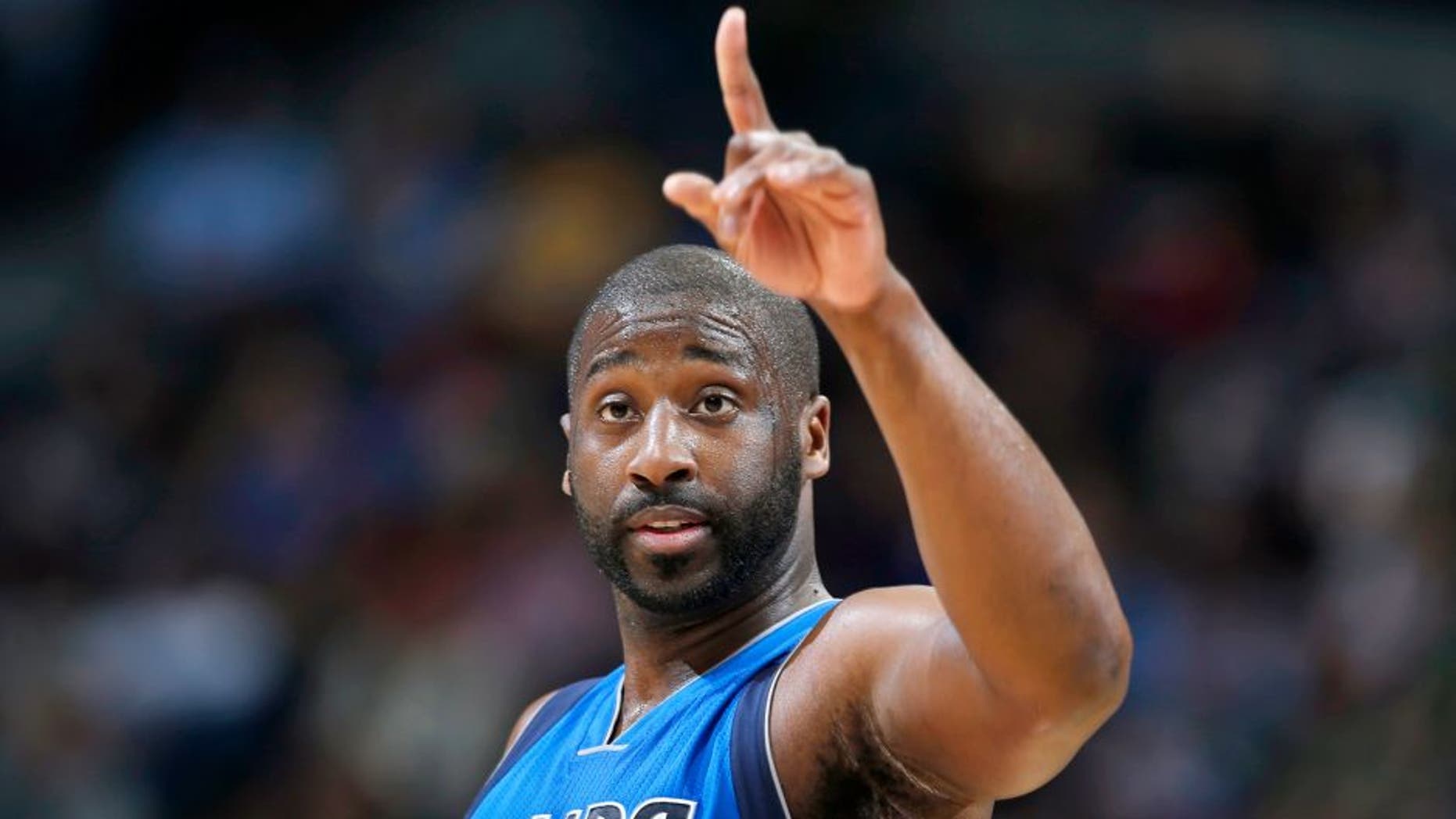 Dallas Mavericks guard Raymond Felton gestures after hitting a basket against the Denver Nuggets in the third quarter of an NBA basketball game Friday, April 10, 2015, in Denver. Dallas won 144-143 in two overtimes. Felton ended up scoring the winning basket. (AP Photo/David Zalubowski)