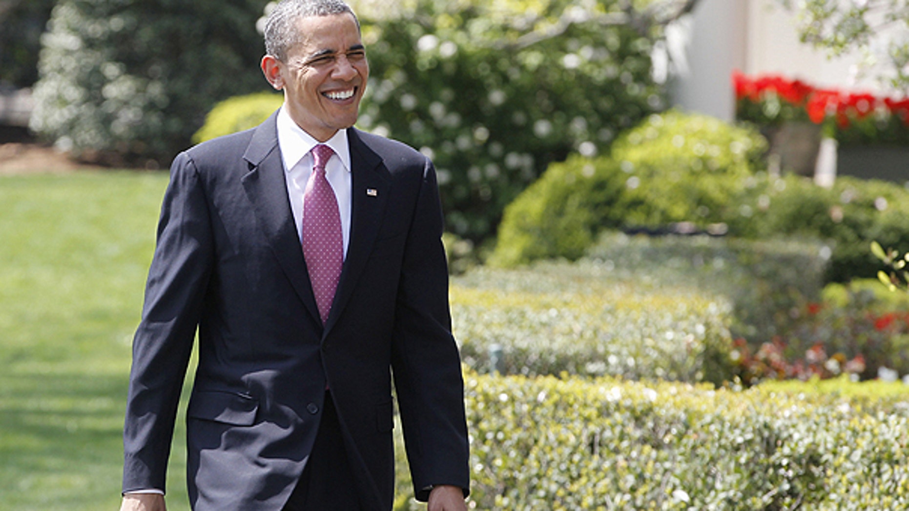 April 11: President Obama smiles as he walks to meet students from Altona Middle School in Longmont, Colo., on the South Portico of the White House in Washington.