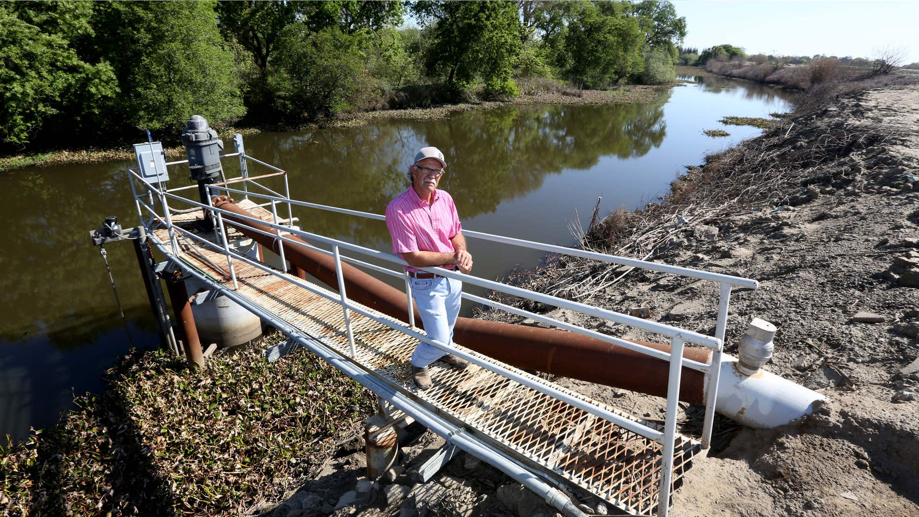 March 27, 2015: Farmer Rudy Mussi poses at one of his pumps that draws water from a slough to irrigate his farm land in the Sacramento-San Joaquin Delta near Stockton, Calif.