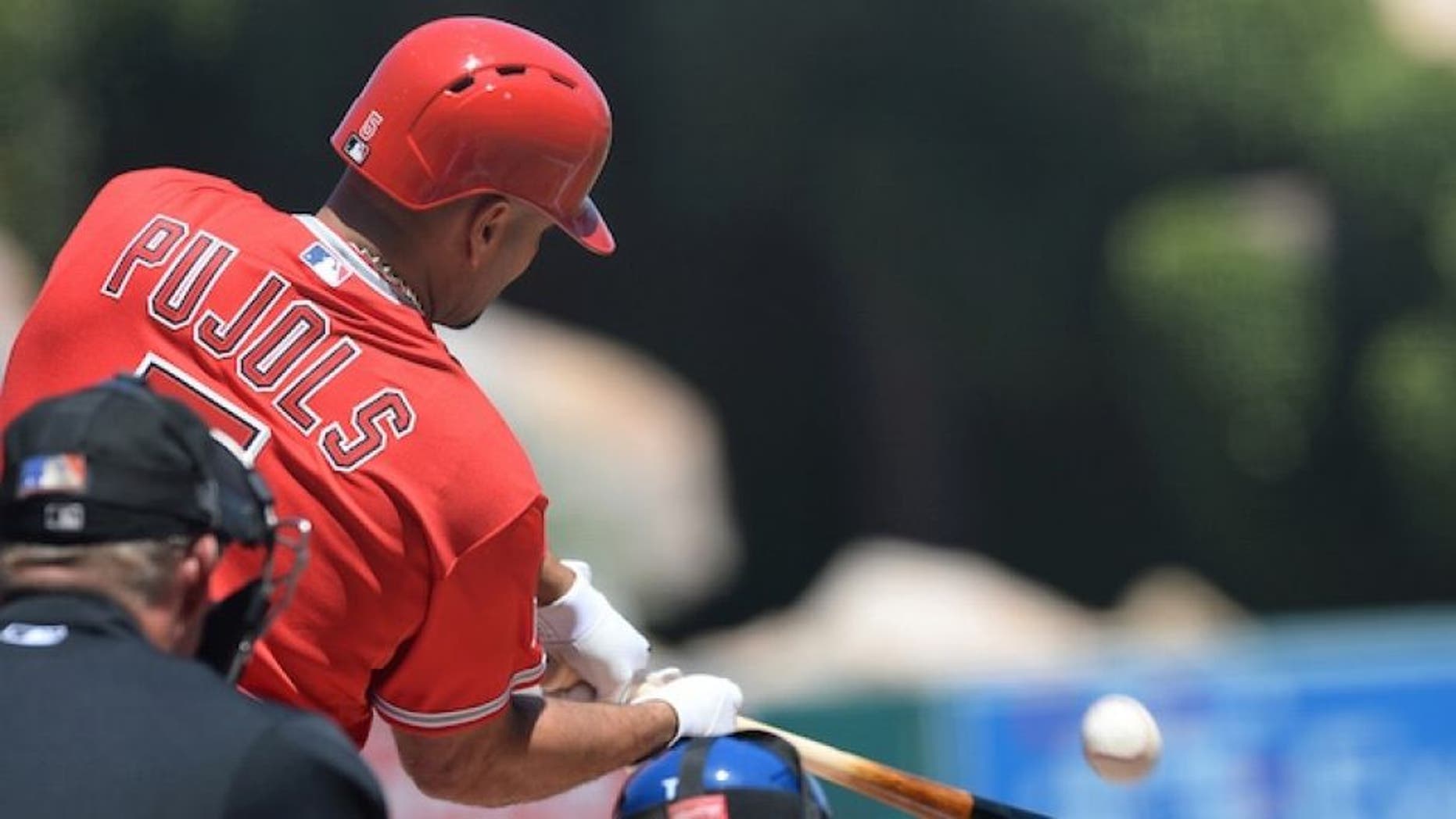 Apr 12, 2015; Anaheim, CA, USA; Los Angeles Angels first baseman Albert Pujols (5) connects for a solo home run in the first inning of the game against the Kansas City Royals at Angel Stadium of Anaheim. Mandatory Credit: Jayne Kamin-Oncea-USA TODAY Sports