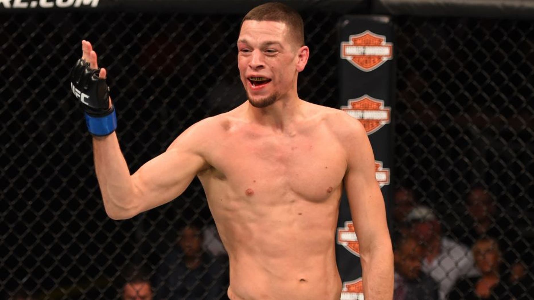 ORLANDO, FL - DECEMBER 19: Nate Diaz taunts Michael Johnson in their lightweight bout during the UFC Fight Night event at the Amway Center on December 19, 2015 in Orlando, Florida. (Photo by Josh Hedges/Zuffa LLC/Zuffa LLC via Getty Images)