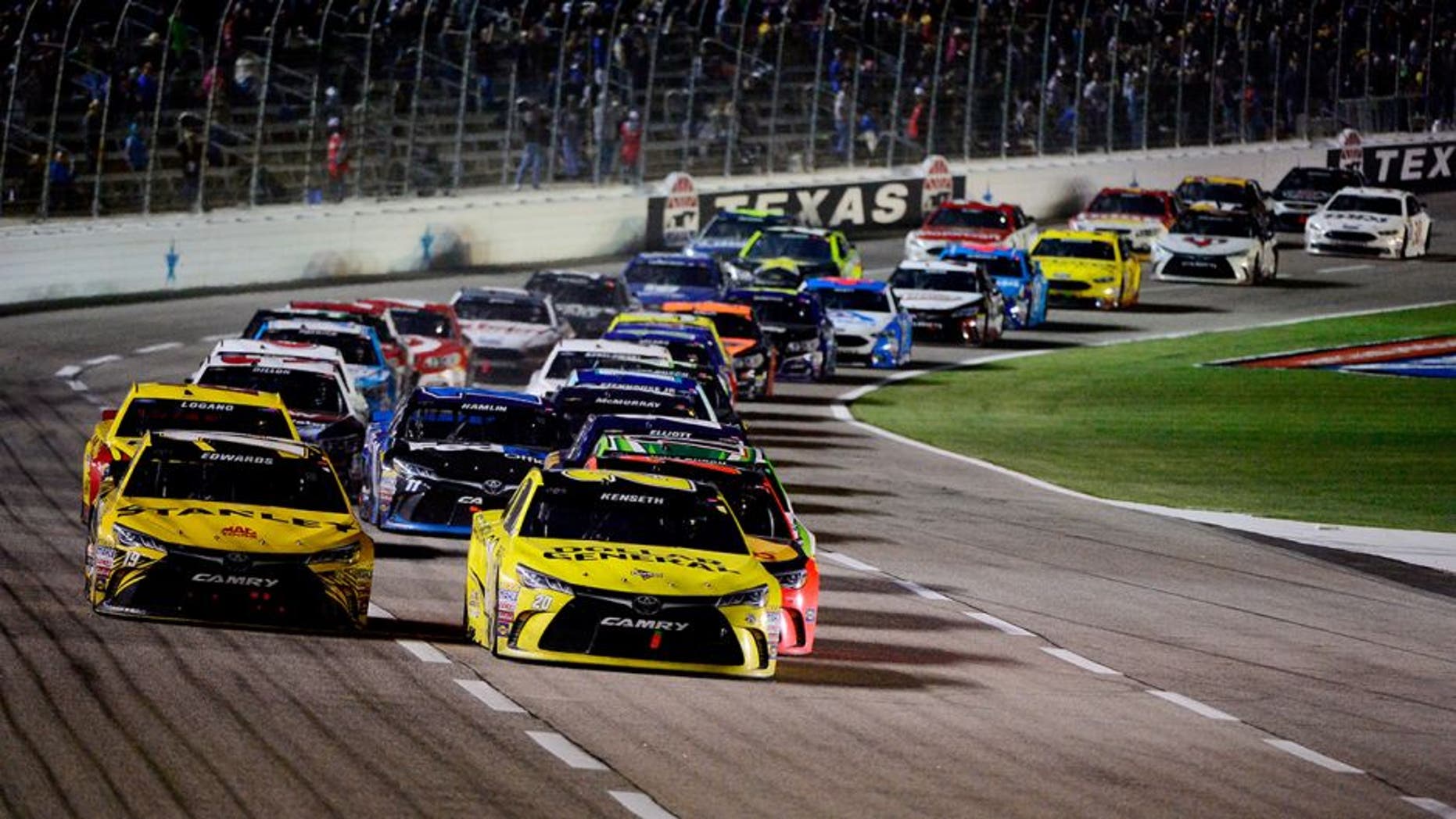 FORT WORTH, TEXAS - APRIL 09: Matt Kenseth, driver of the #20 Dollar General Toyota, leads the field in a restart during the NASCAR Sprint Cup Series Duck Commander 500 at Texas Motor Speedway on April 9, 2016 in Fort Worth, Texas. (Photo by Robert Laberge/NASCAR via Getty Images)