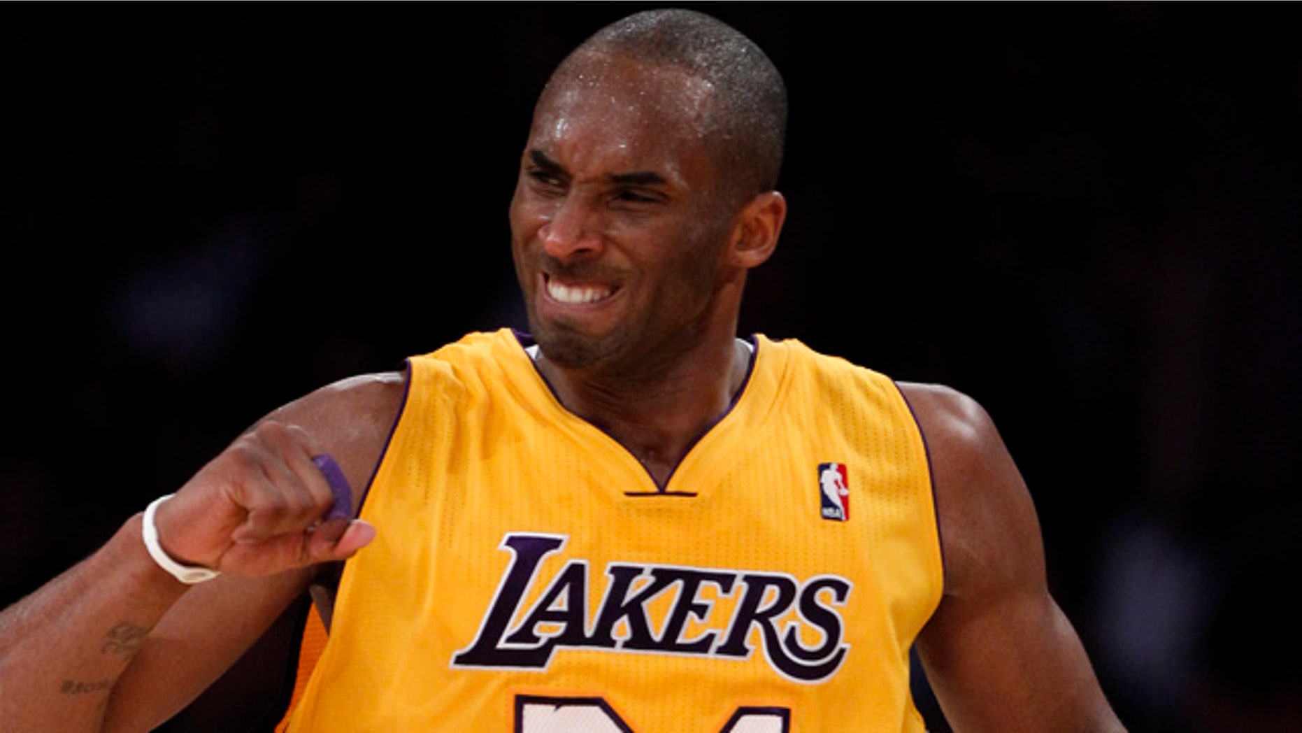 April 12: Los Angeles Lakers' Kobe Bryant celebrates after making a three-point basket against the San Antonio Spurs during the second half of an NBA basketball game in Los Angeles.