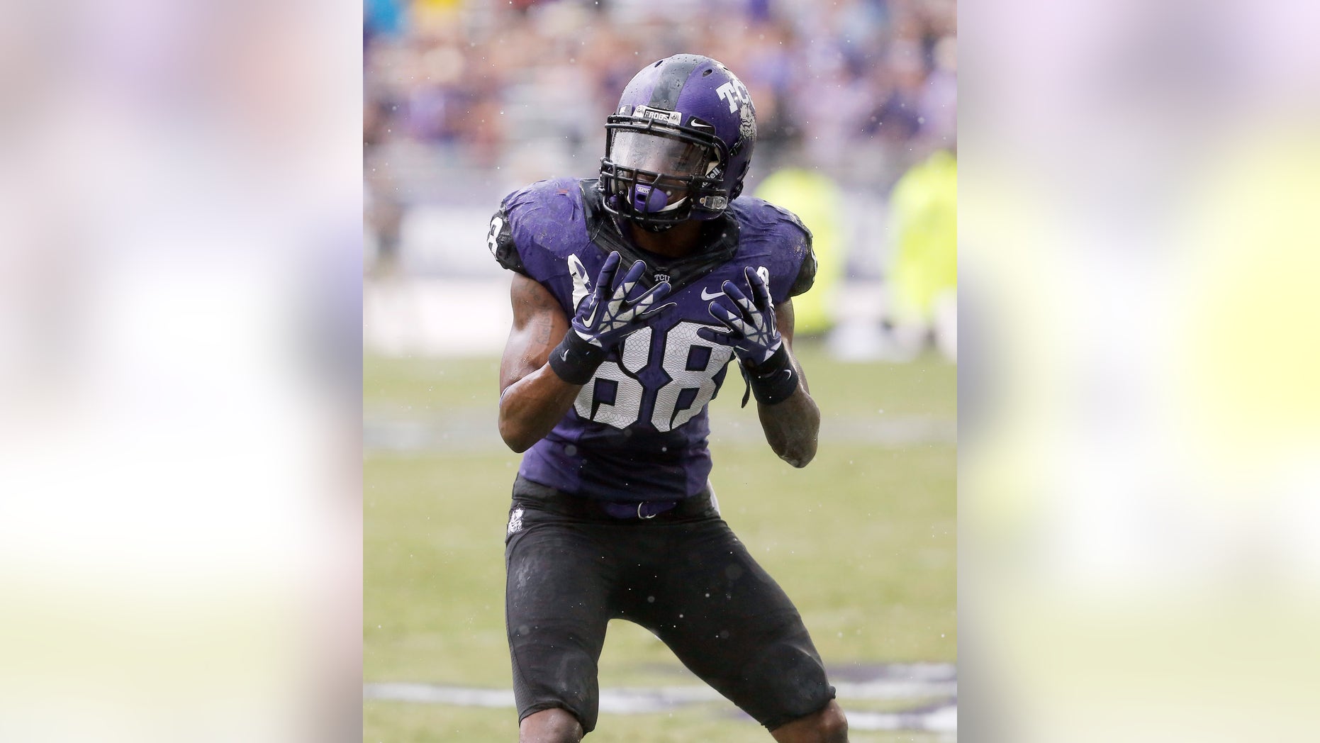 TCU wide receiver Cam White (88) reacts after a pass slipped through his hands during a rain shower in the second half of an NCAA college football game against SMU Saturday, Sept. 28, 2013, in Fort Worth, Texas. TCU won 48-17.(AP Photo/Brandon Wade)