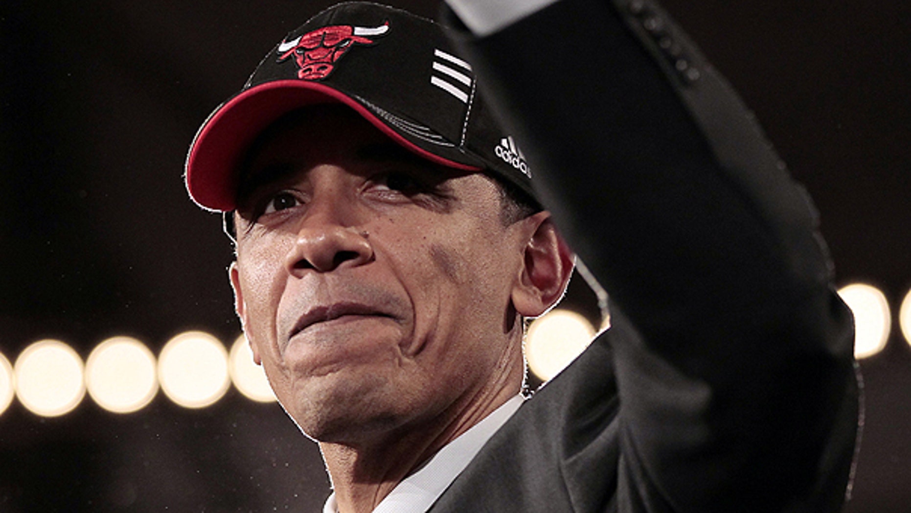 April 14: President Obama wears Chicago Bulls basketball cap after delivering remarks at a DNC fundraiser at Navy Pier in Chicago.