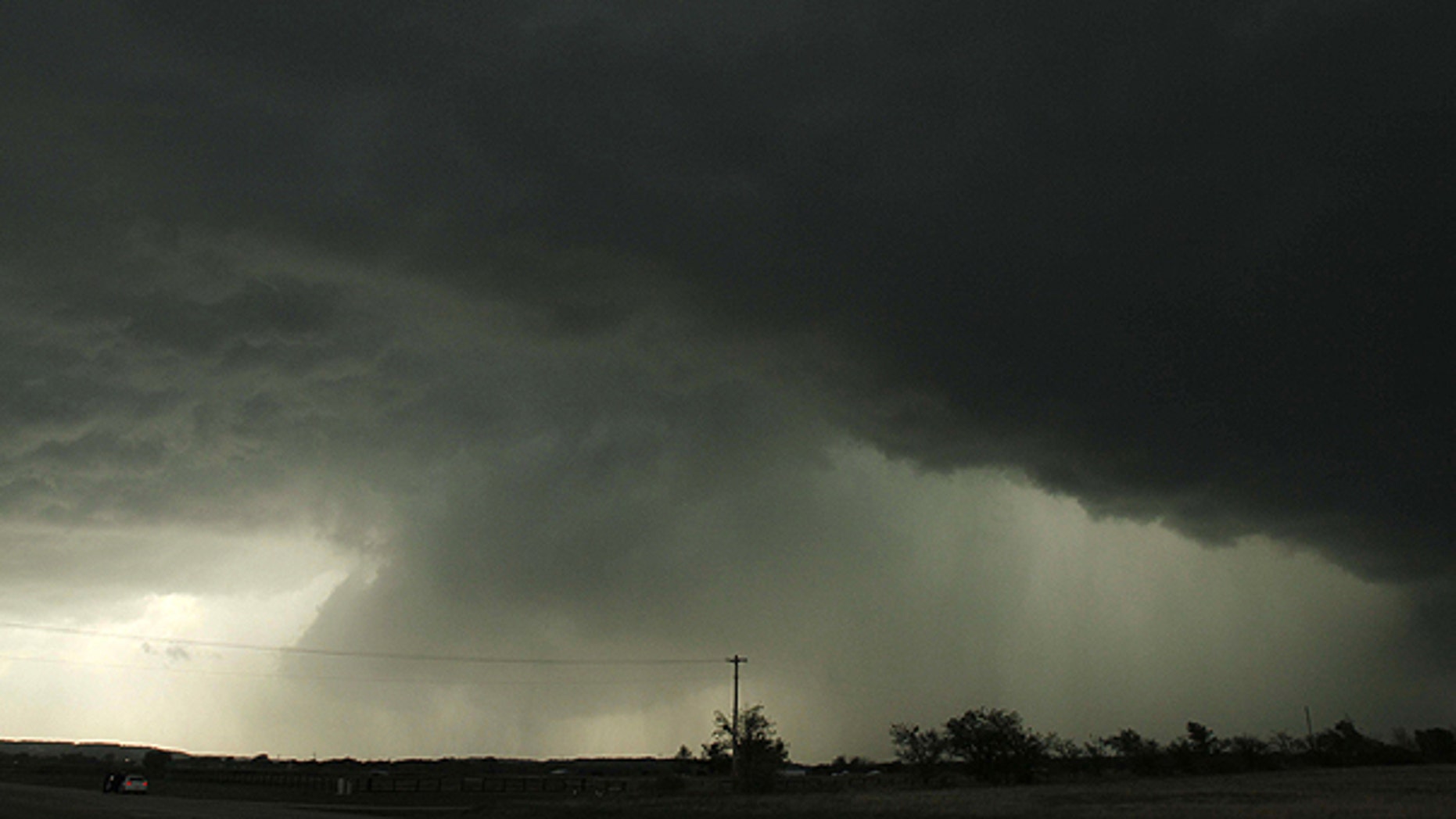 April 14: Storm clouds pass north of Kiefer, Okla. Numerous severe thunderstorms with large hail and winds gusting to 70 mph were reported with many of the storms moving through southeastern Oklahoma.