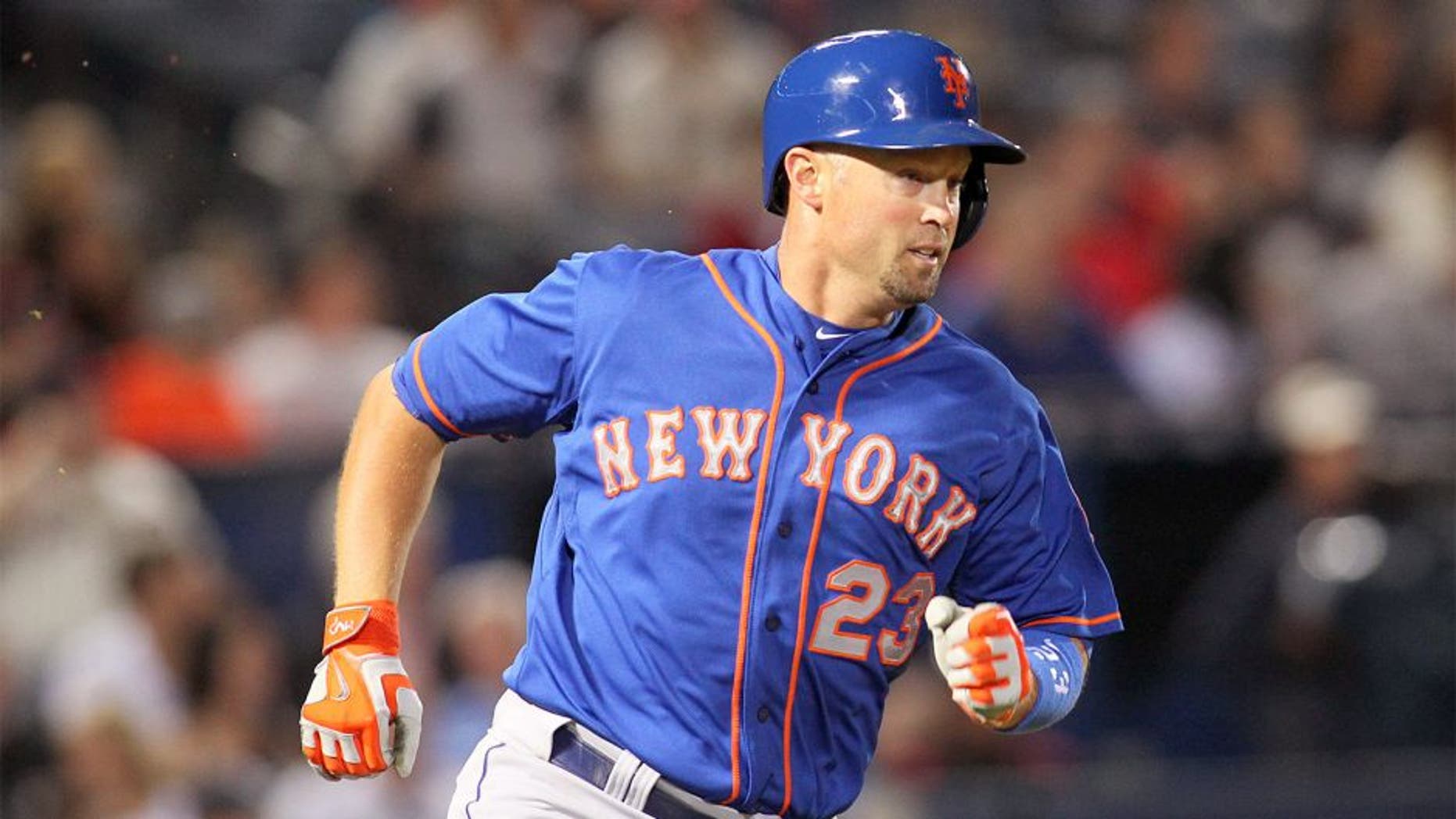 Apr 10, 2015; Atlanta, GA, USA; New York Mets left fielder Michael Cuddyer (23) hits a single against the Atlanta Braves in the fourth inning at Turner Field. Mandatory Credit: Brett Davis-USA TODAY Sports