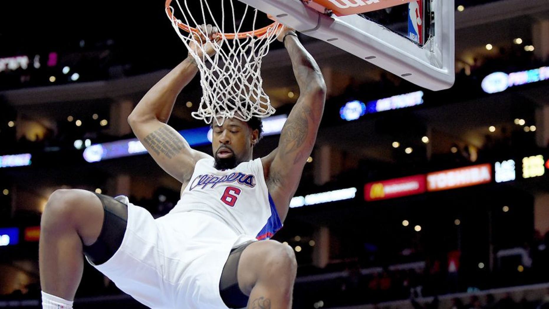 LOS ANGELES, CA - APRIL 13: DeAndre Jordan #6 of the Los Angeles Clippers scores on a dunk in front of Randy Foye #4 of the Denver Nuggets during a 110-103 Clipper win at Staples Center on April 13, 2015 in Los Angeles, California. NOTE TO USER: User expressly acknowledges and agrees that, by downloading and or using this Photograph, user is consenting to the terms and condition of the Getty Images License Agreement. (Photo by Harry How/Getty Images)