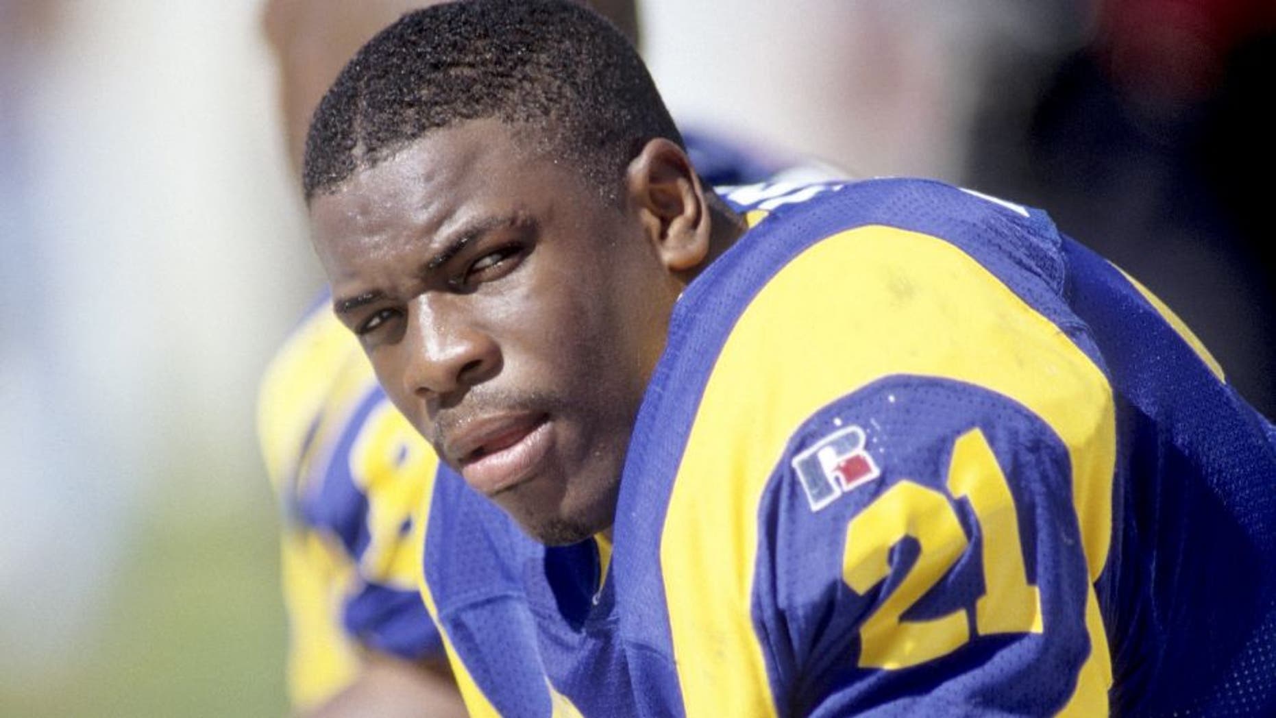 CHARLOTTE, NC - OCTOBER 13: Lawrence Phillips #21 of the St. Louis Rams looks on against the Carolina Panthers at Ericsson Stadium on October 13, 1996 in Charlotte, North Carolina. The Panthers defeated the Rams 45-13. (Photo by Joe Robbins/Getty Images)