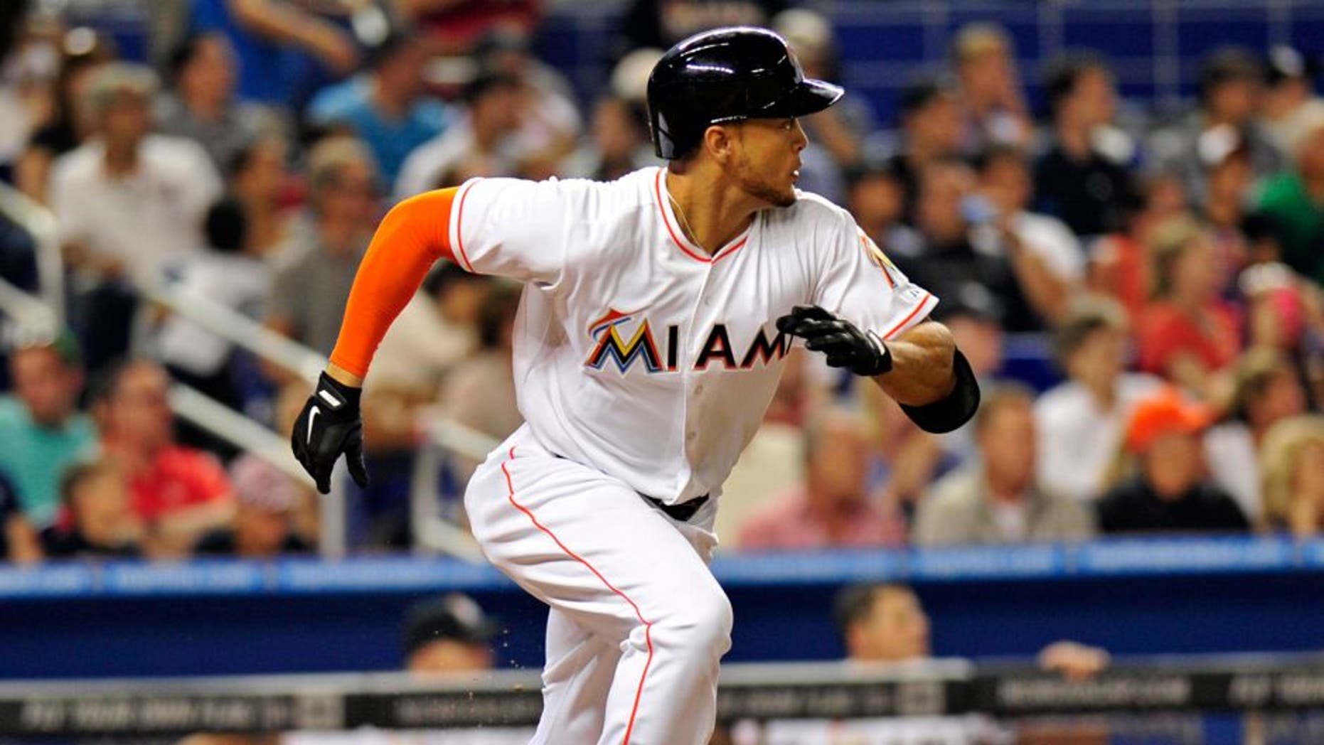 Apr 15, 2014; Miami, FL, USA; Miami Marlins right fielder Giancarlo Stanton connects for an RBI single during the fifth inning against the Washington Nationals at Marlins Ballpark. Mandatory Credit: Steve Mitchell-USA TODAY Sports