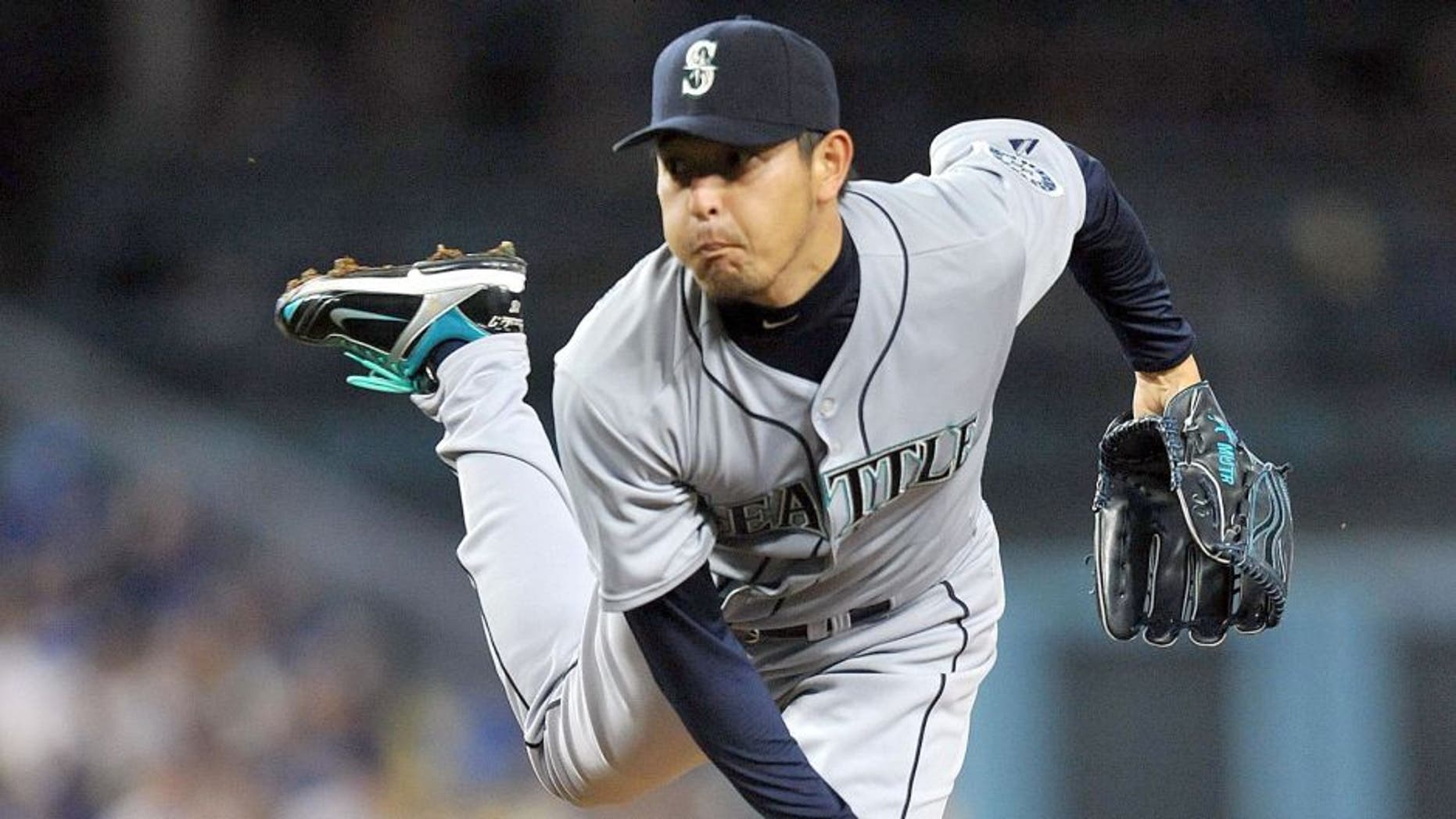 April 14, 2015; Los Angeles, CA, USA; Seattle Mariners starting pitcher Hisashi Iwakuma (18) pitches the fourth inning against the Los Angeles Dodgers at Dodger Stadium. Mandatory Credit: Gary A. Vasquez-USA TODAY Sports
