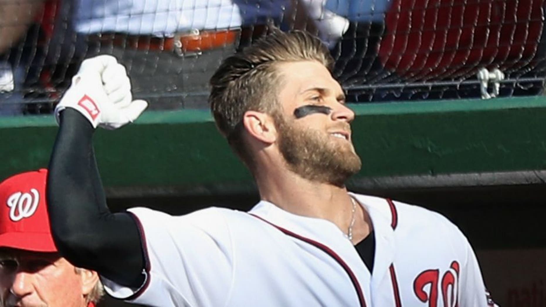 at Nationals Park on April 14, 2016 in Washington, DC.,WASHINGTON, DC - APRIL 14: Bryce Harper #34 of the Washington Nationals acknowledges the crowd after hitting a third inning grand slam against the Atlanta Braves at Nationals Park on April 14, 2016 in Washington, DC. (Photo by Rob Carr/Getty Images)
