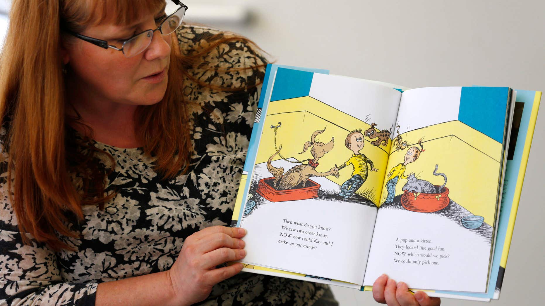 July 28, 2015: Reference librarian Marlayna Christensen reads to children Dr. Seuss' new book "What Pet Should I Get?" at the University of California San Diego's Geisel Library in San Diego.
