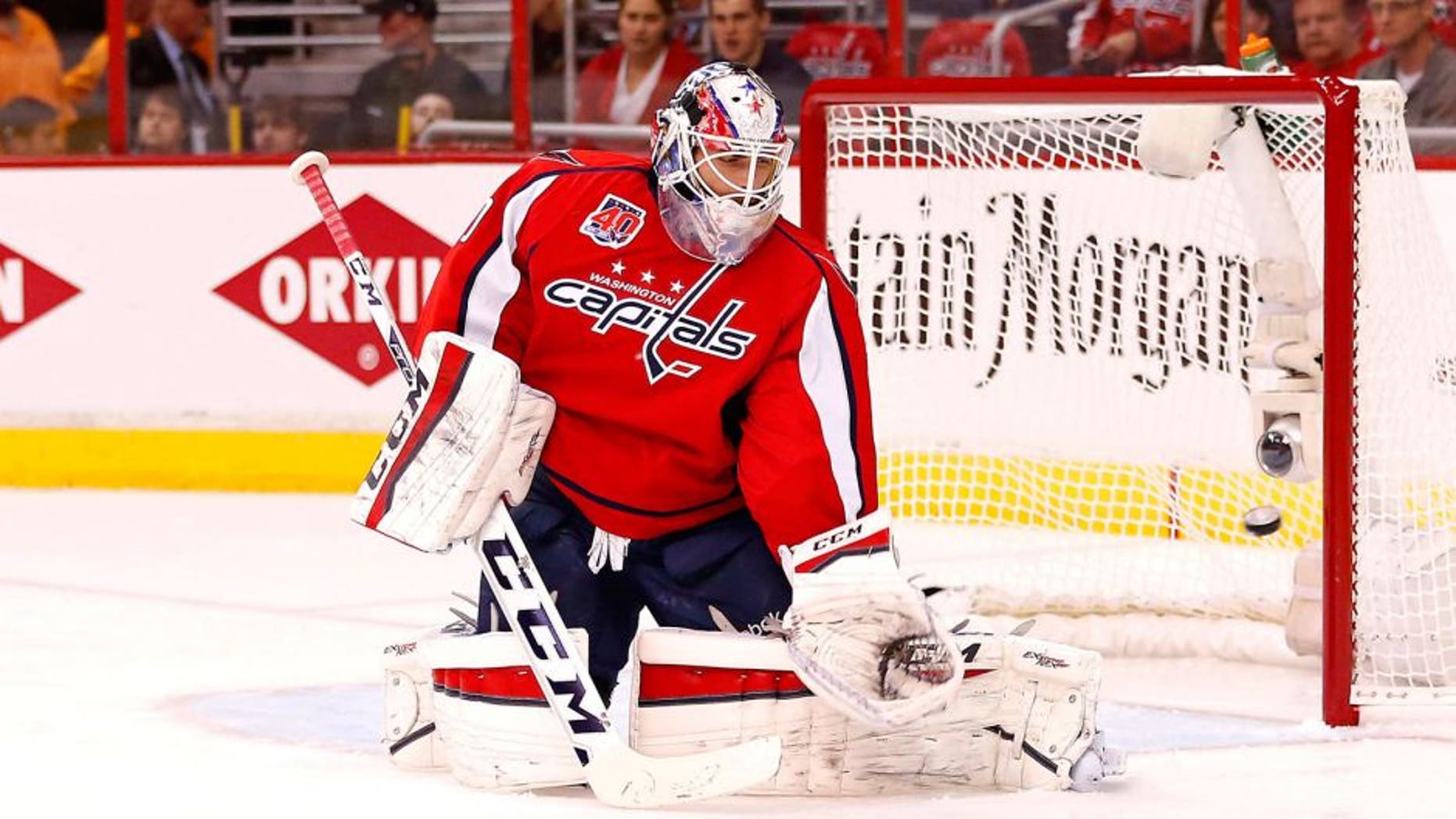 Apr 15, 2015; Washington, DC, USA; Washington Capitals goalie Braden Holtby (70) is beaten by a shot from New York Islanders center Brock Nelson (not pictured) in the first period in game one of the first round of the the 2015 Stanley Cup Playoffs at Verizon Center. Mandatory Credit: Geoff Burke-USA TODAY Sports