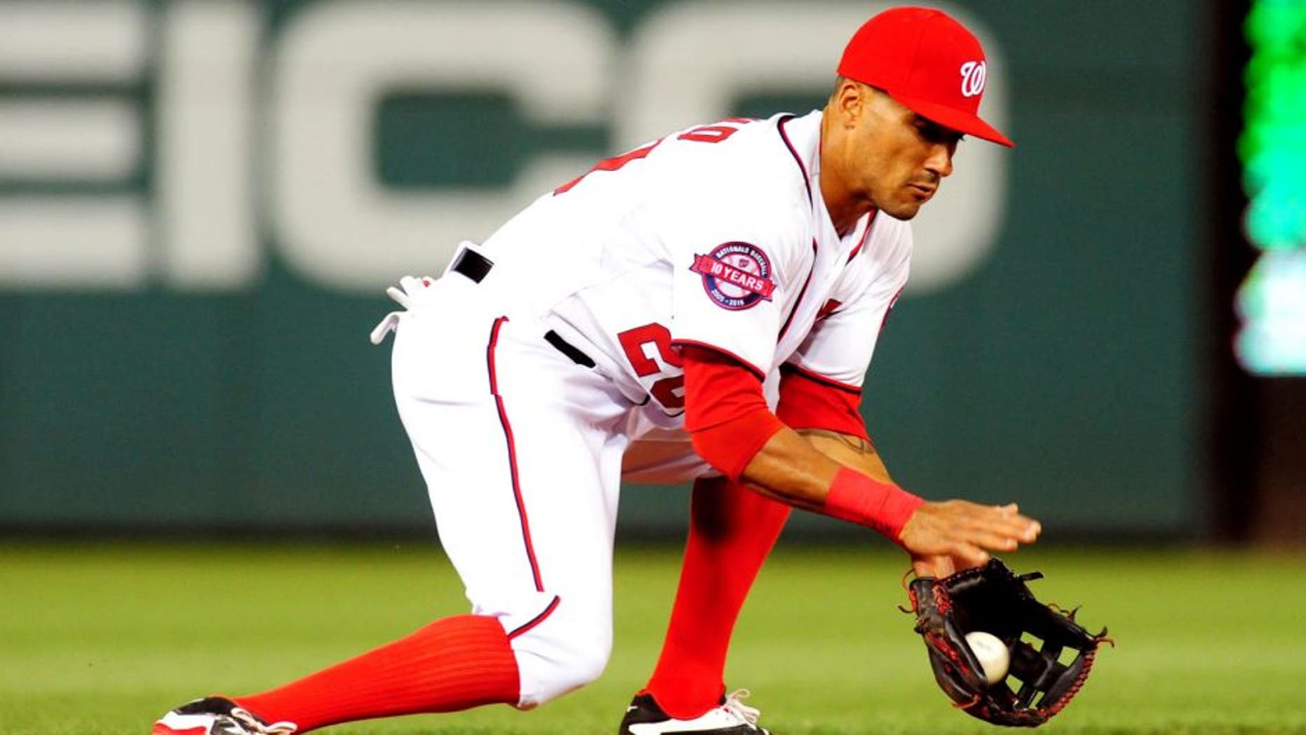 Apr 16, 2015; Washington, DC, USA; Washington Nationals shortstop Ian Desmond (20) fields a ground ball during the game against the Philadelphia Phillies at Nationals Park. The Nationals won 5-2. Mandatory Credit: Evan Habeeb-USA TODAY Sports