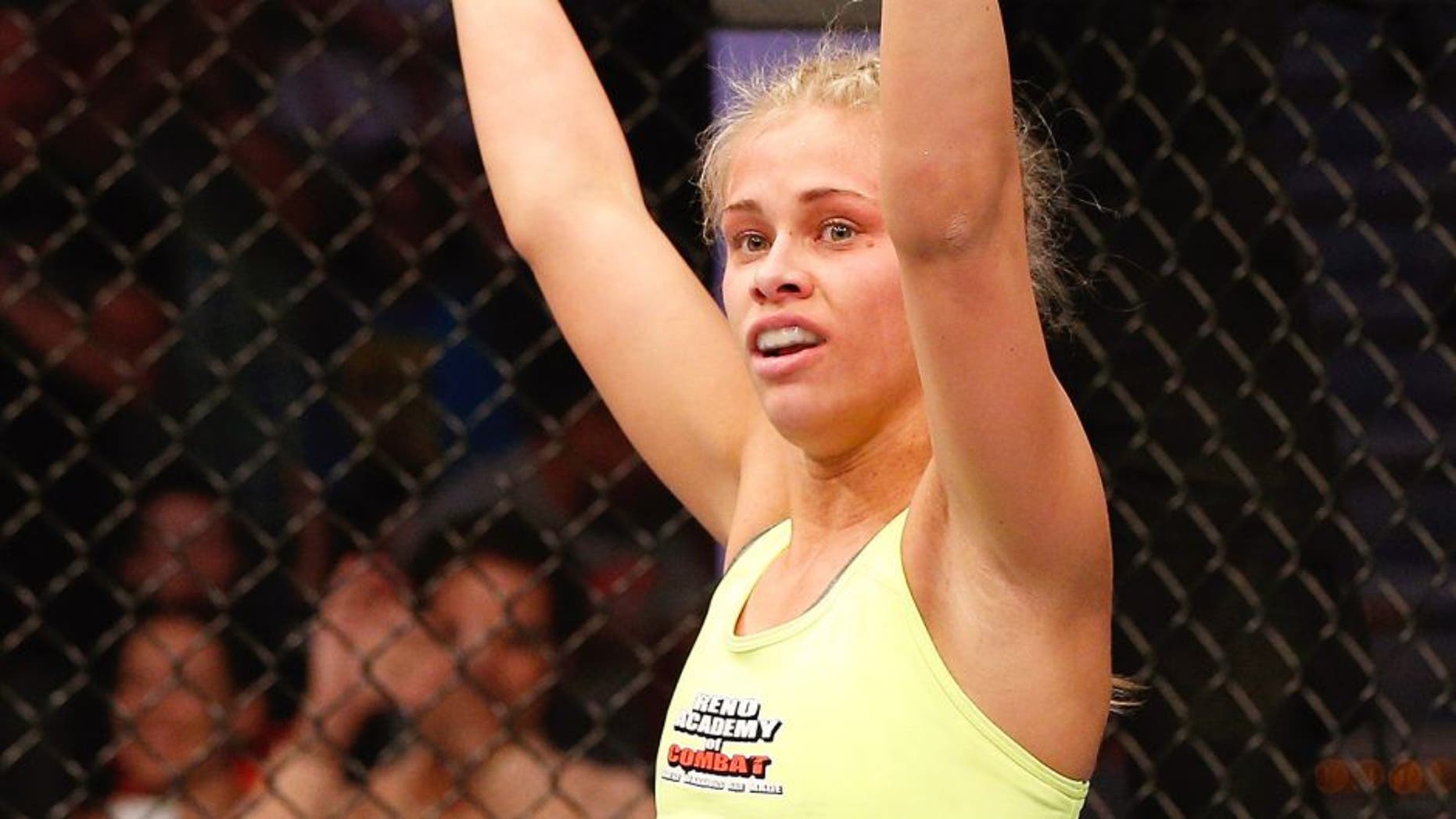 AUSTIN, TX - NOVEMBER 22: Paige VanZant reacts after an exciting first round of her women's bantamweight bout against Kailin Curran during the UFC Fight Night event at The Frank Erwin Center on November 22, 2014 in Austin, Texas. (Photo by Josh Hedges/Zuffa LLC/Zuffa LLC via Getty Images)