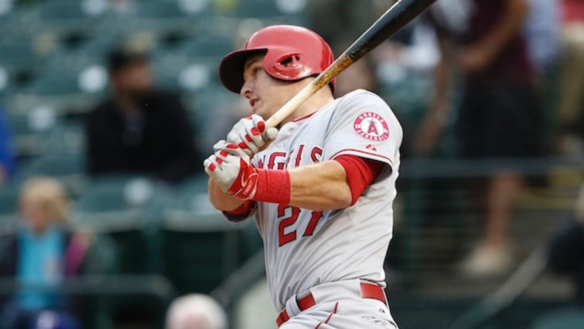 Apr 14, 2015; Arlington, TX, USA; Los Angeles Angels center fielder Mike Trout (27) follows through on a double against the Texas Rangers during the first inning of a baseball game at Globe Life Park in Arlington. Mandatory Credit: Jim Cowsert-USA TODAY Sports