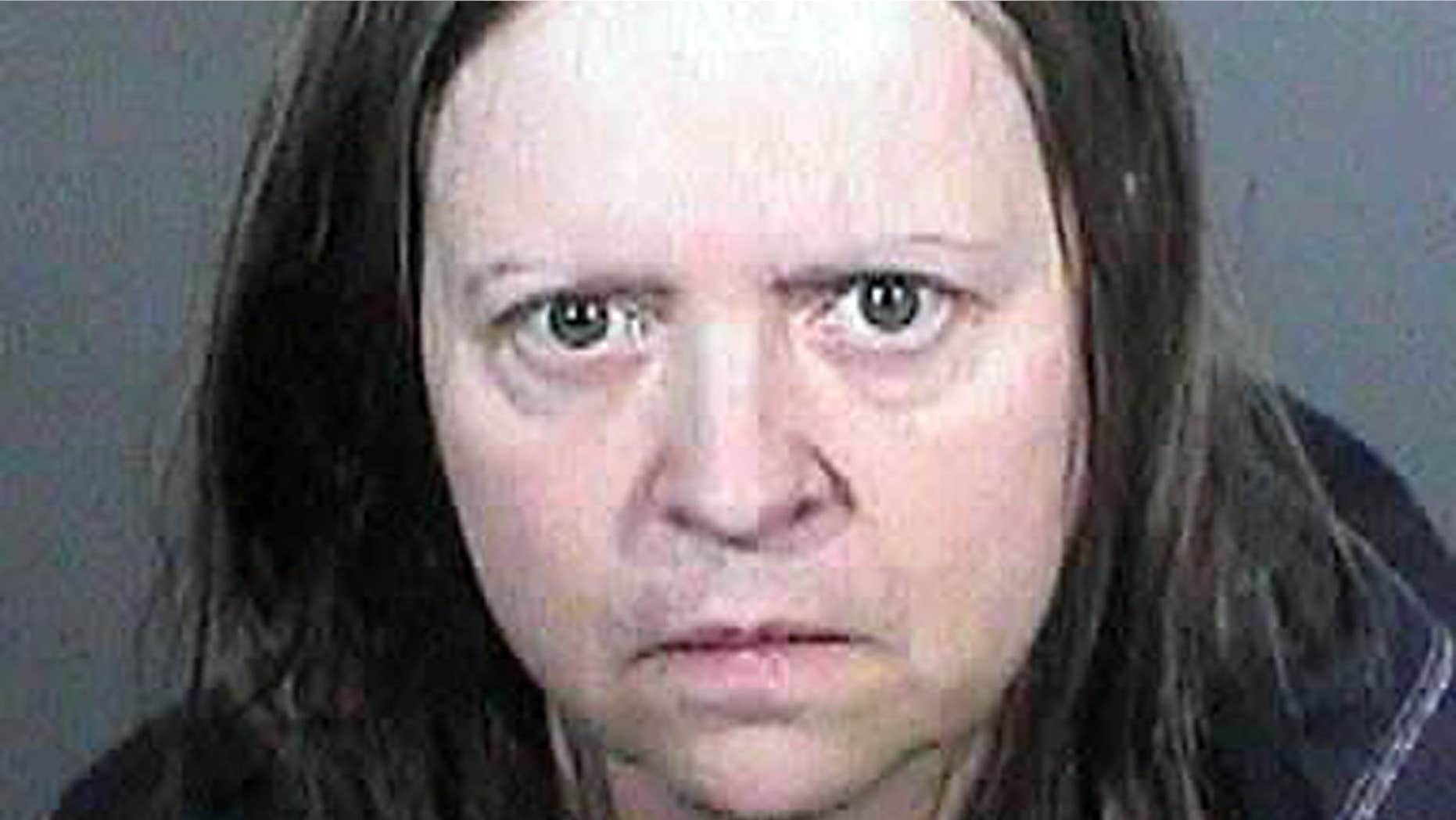 This undated law enforcement booking photo from the Los Angeles County Sheriff's Office shows Cathryn Parker.