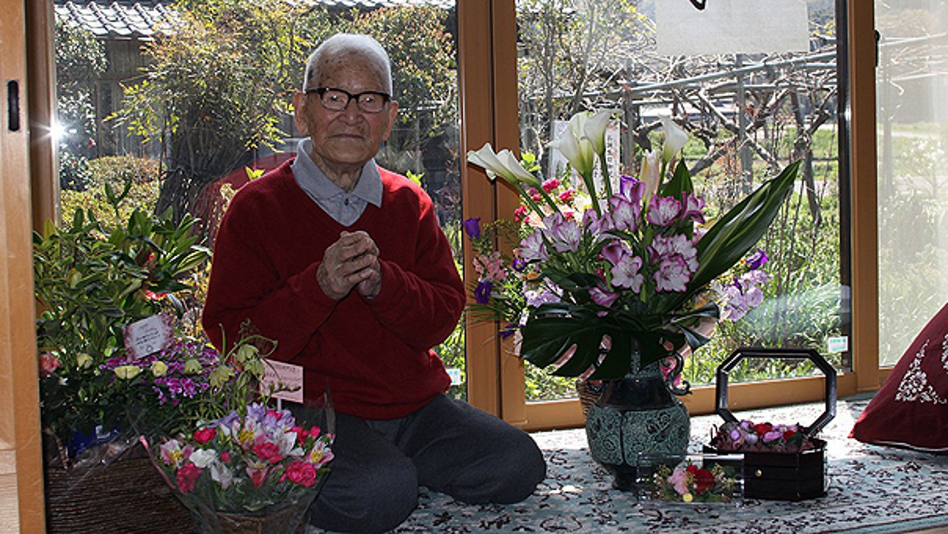 April 19: In this photo released by Kyotango City Office, Jirouemon Kimura poses during his 114th birthday at his home in Kyotango, western Japan.