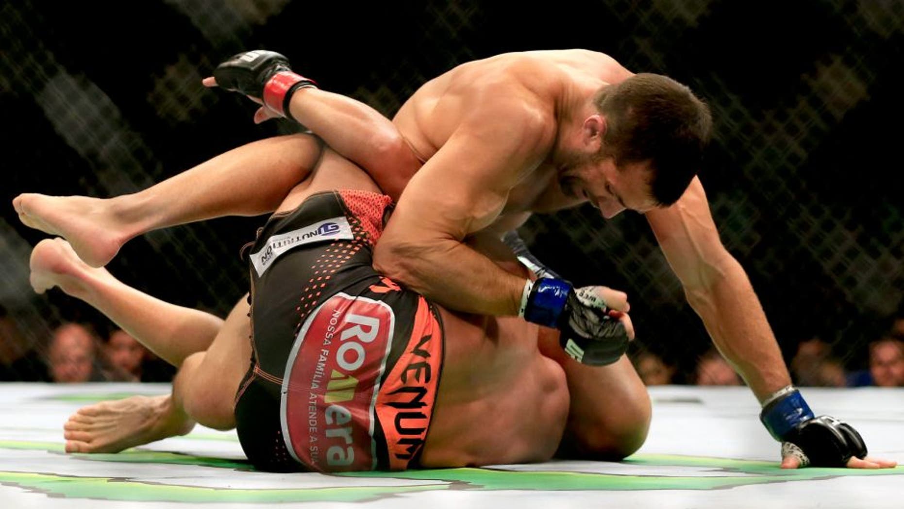 NEWARK, NJ - APRIL 18: Luke Rockhold and Lyoto Machida of Brazil grapple in their middleweight bout during the UFC Fight Night event at Prudential Center on April 18, 2015 in Newark, New Jersey. (Photo by Alex Trautwig/Getty Images)