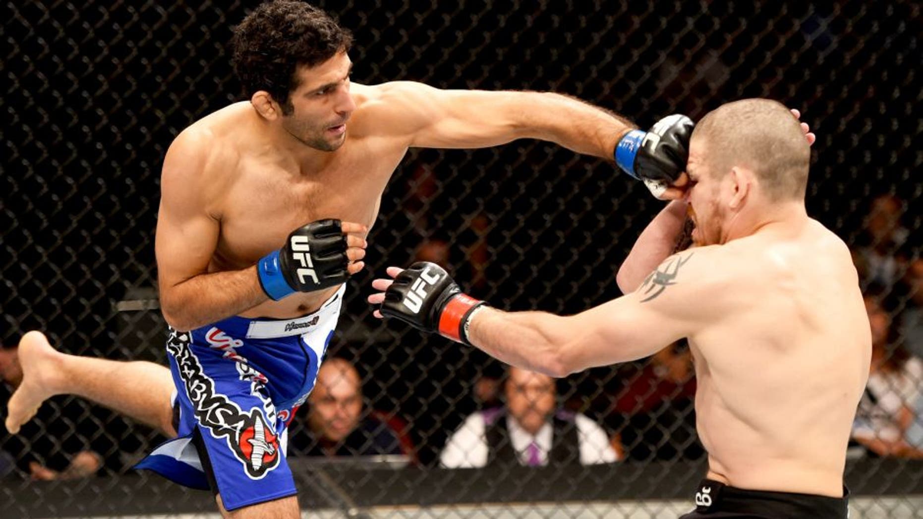 NEWARK, NJ - APRIL 18: Beneil Dariush (L) of Iran punches Jim Miller in their lightweight bout during the UFC Fight Night event at Prudential Center on April 18, 2015 in Newark, New Jersey. (Photo by Josh Hedges/Zuffa LLC/Zuffa LLC via Getty Images)