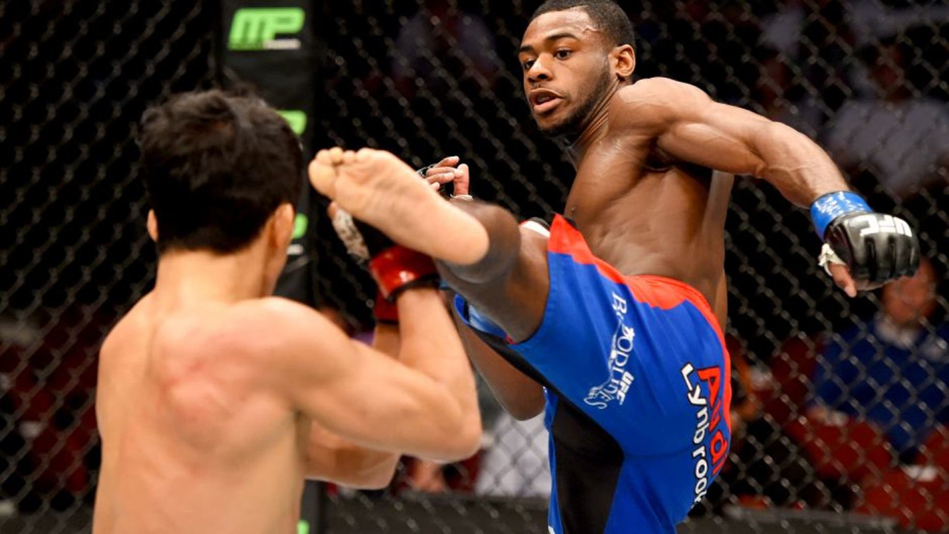 NEWARK, NJ - APRIL 18: Aljamain Sterling (R) kicks Takeya Mizugaki of Japan in their bantamweight bout during the UFC Fight Night event at Prudential Center on April 18, 2015 in Newark, New Jersey. (Photo by Josh Hedges/Zuffa LLC/Zuffa LLC via Getty Images)