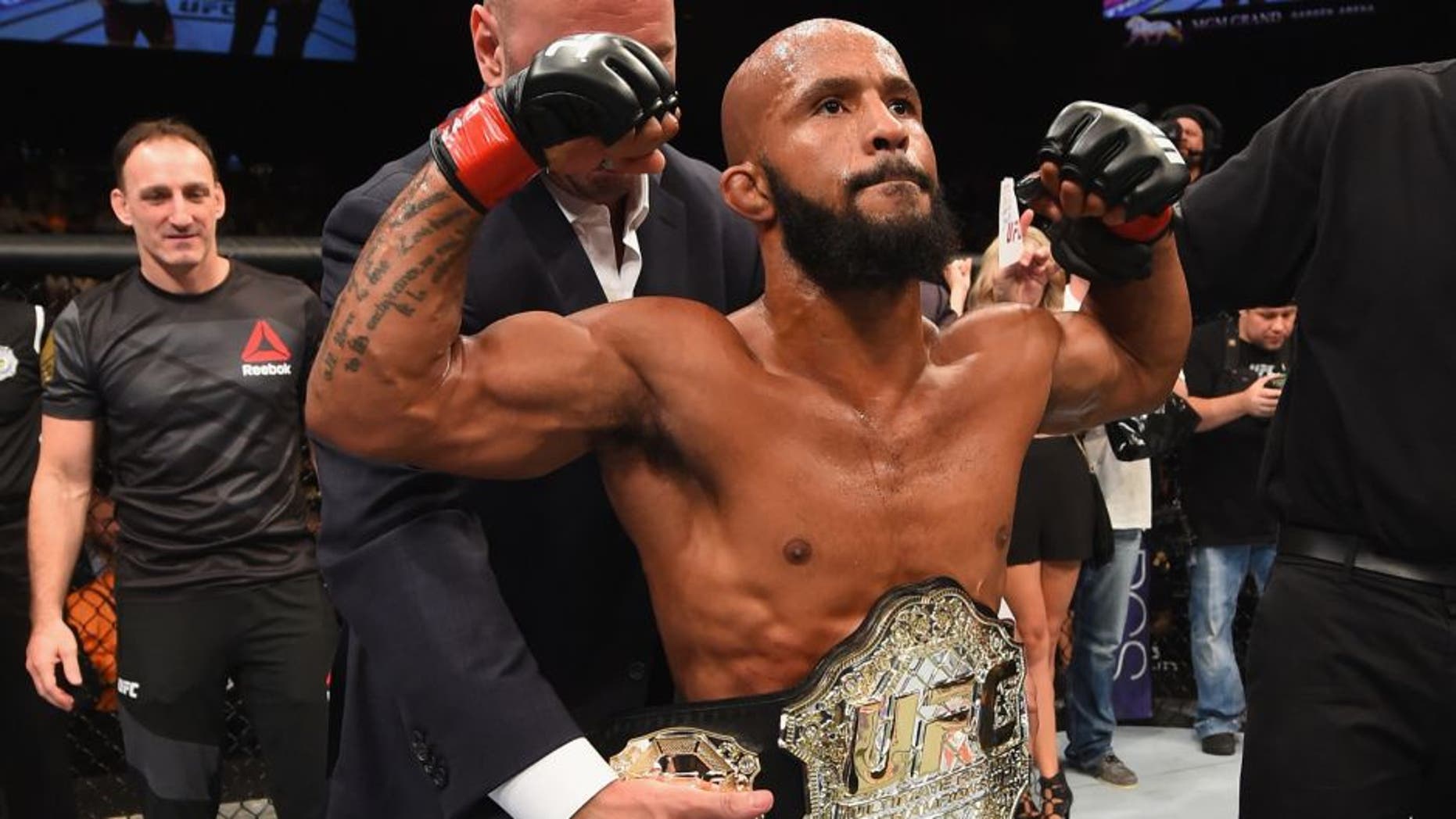 LAS VEGAS, NV - SEPTEMBER 05: Demetrious Johnson reacts to his victory over John Dodson in their flyweight championship bout during the UFC 191 event inside MGM Grand Garden Arena on September 5, 2015 in Las Vegas, Nevada. (Photo by Josh Hedges/Zuffa LLC/Zuffa LLC via Getty Images)