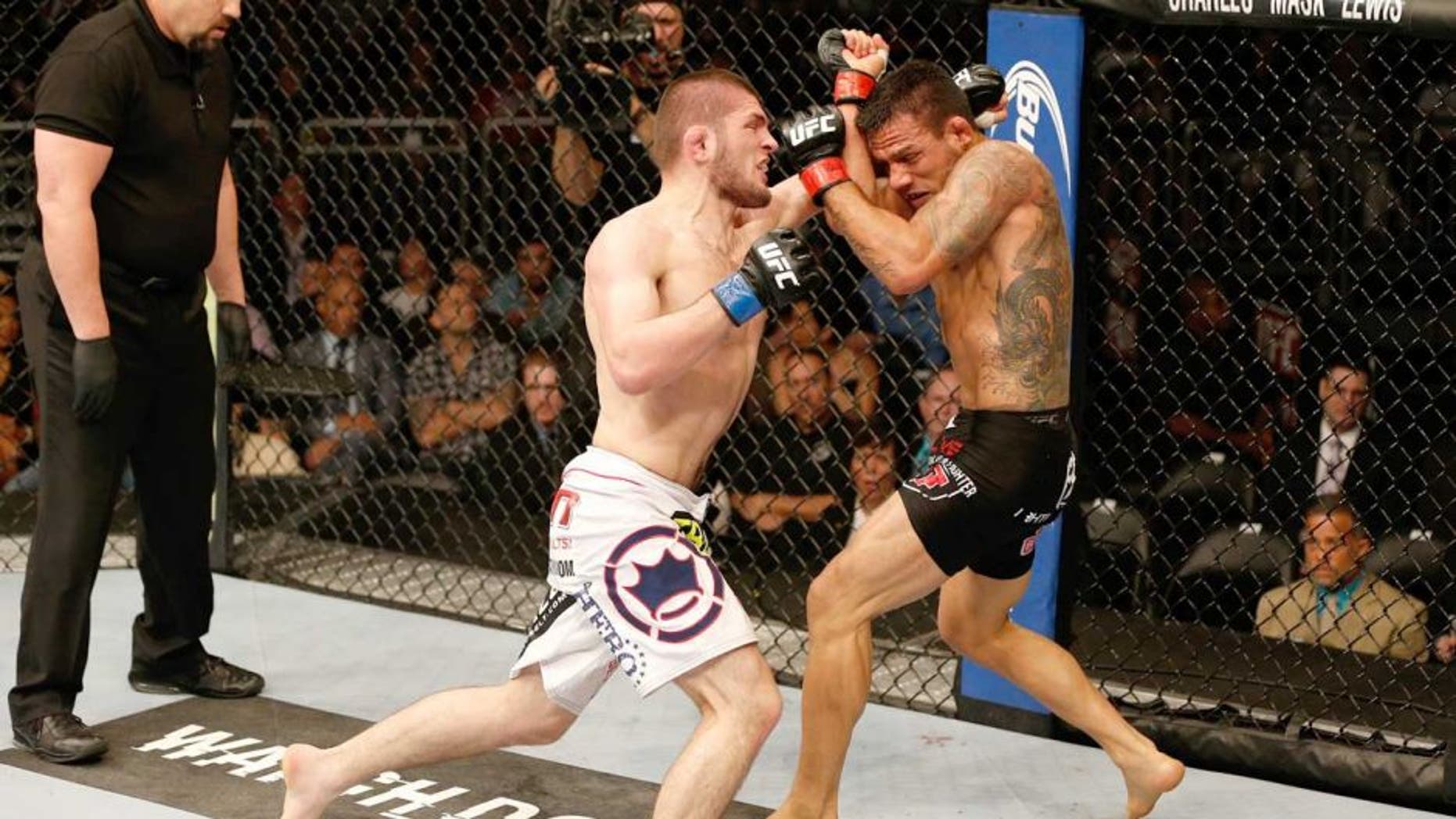 ORLANDO, FL - APRIL 19: (L-R) Khabib Nurmagomedov punches Rafael dos Anjos in their lightweight bout during the FOX UFC Saturday event at the Amway Center on April 19, 2014 in Orlando, Florida. (Photo by Josh Hedges/Zuffa LLC/Zuffa LLC via Getty Images)