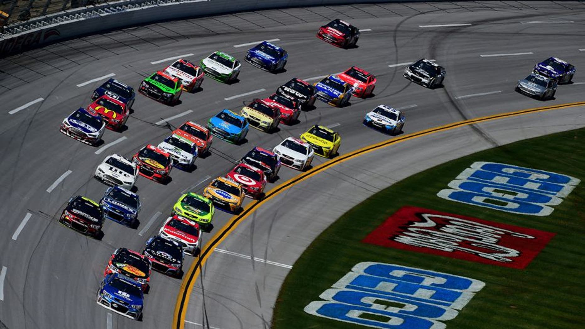 TALLADEGA, AL - MAY 03: Dale Earnhardt Jr., driver of the #88 Nationwide Chevrolet, leads a pack of cars during the NASCAR Sprint Cup Series GEICO 500 at Talladega Superspeedway on May 3, 2015 in Talladega, Alabama. (Photo by Jared C. Tilton/Getty Images)