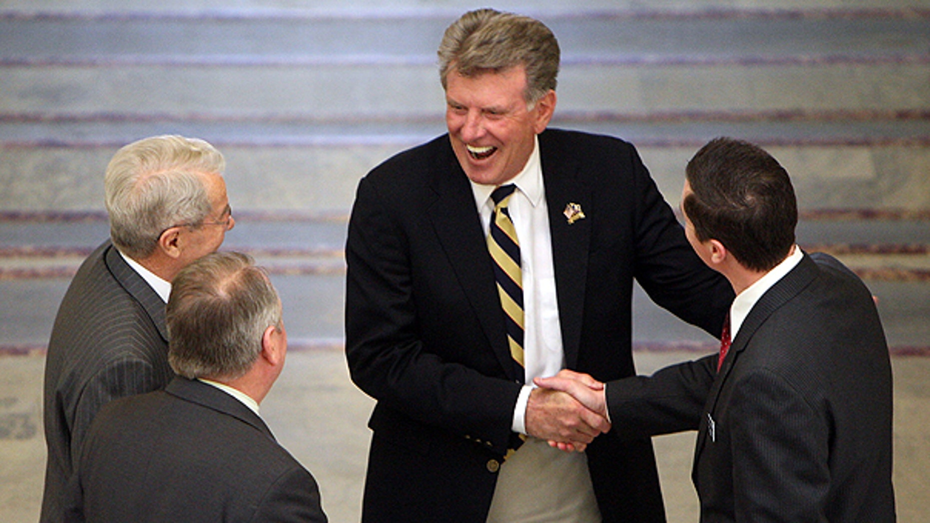April 7: A House committee made up of Reps. Brian Cronin, far right, Fred Wood, and Dell Raybould, far left, inform Idaho Gov. Butch Otter , center, of the body's intent to adjourn for the 2011 legislative session in Boise.