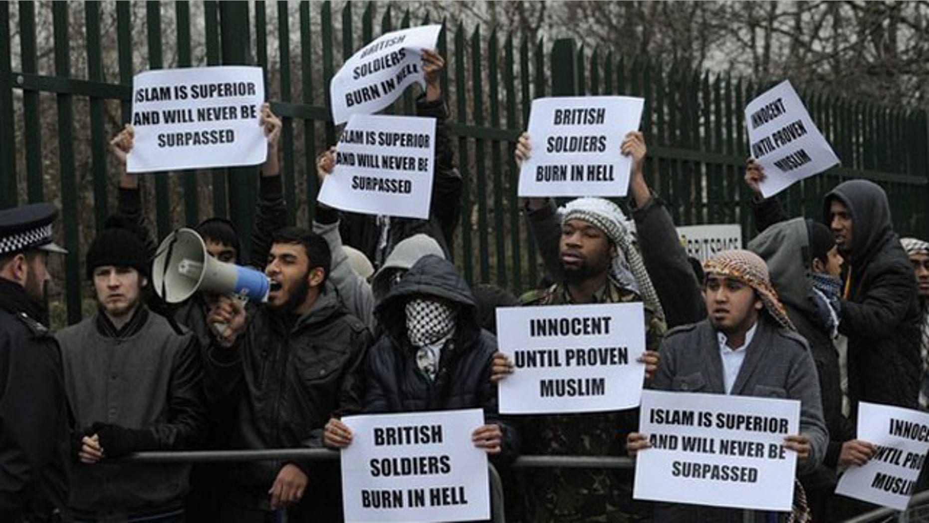 Feb. 23: Demonstrators supporting Mohammad Haque and Emdadur Choudhury protest as they arrive at Belmarsh Magistrates Court in south-east London. The trial of two men accused of burning poppies on the anniversary of Armistice Day started on Wednesday. Mohammad Haque, 30, and Emdadur Choudhury, 26, were arrested during a demonstration by Islamist group Muslims Against Crusades in Kensington, west London, on November 11.