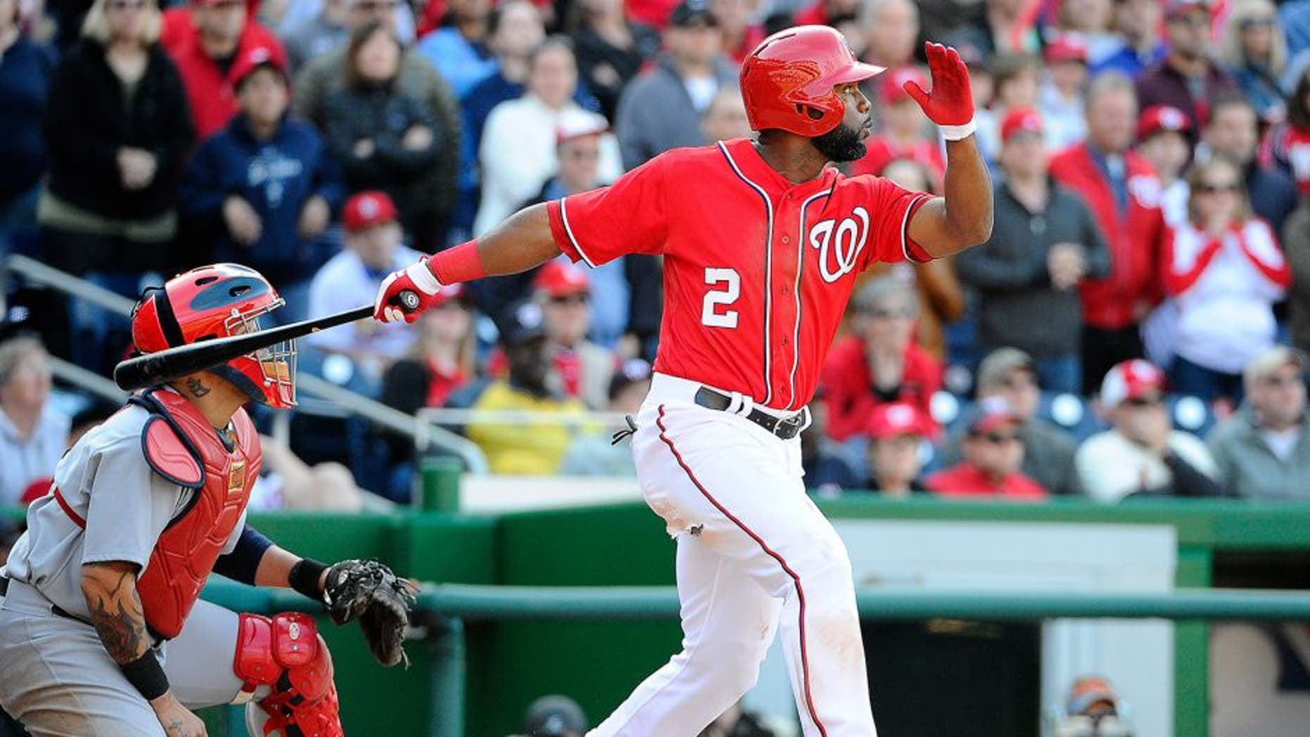 Apr 20, 2014; Washington, DC, USA; Washington Nationals center fielder Denard Span (2) hits a walk off RBI sacrifice fly against the St. Louis Cardinals during the ninth inning at Nationals Park. The Nationals won 3-2. Mandatory Credit: Brad Mills-USA TODAY Sports
