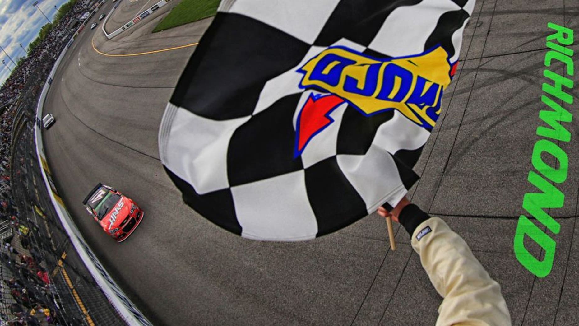 RICHMOND, VA - APRIL 26: (EDITOR'S NOTE: This image has been processed using digital filters.) Kurt Busch, driver of the #41 Haas Automation Chevrolet, takes the checkered flag to win the NASCAR Sprint Cup Series Toyota Owners 400 at Richmond International Raceway on April 26, 2015 in Richmond, Virginia. (Photo by Daniel Shirey/NASCAR via Getty Images)