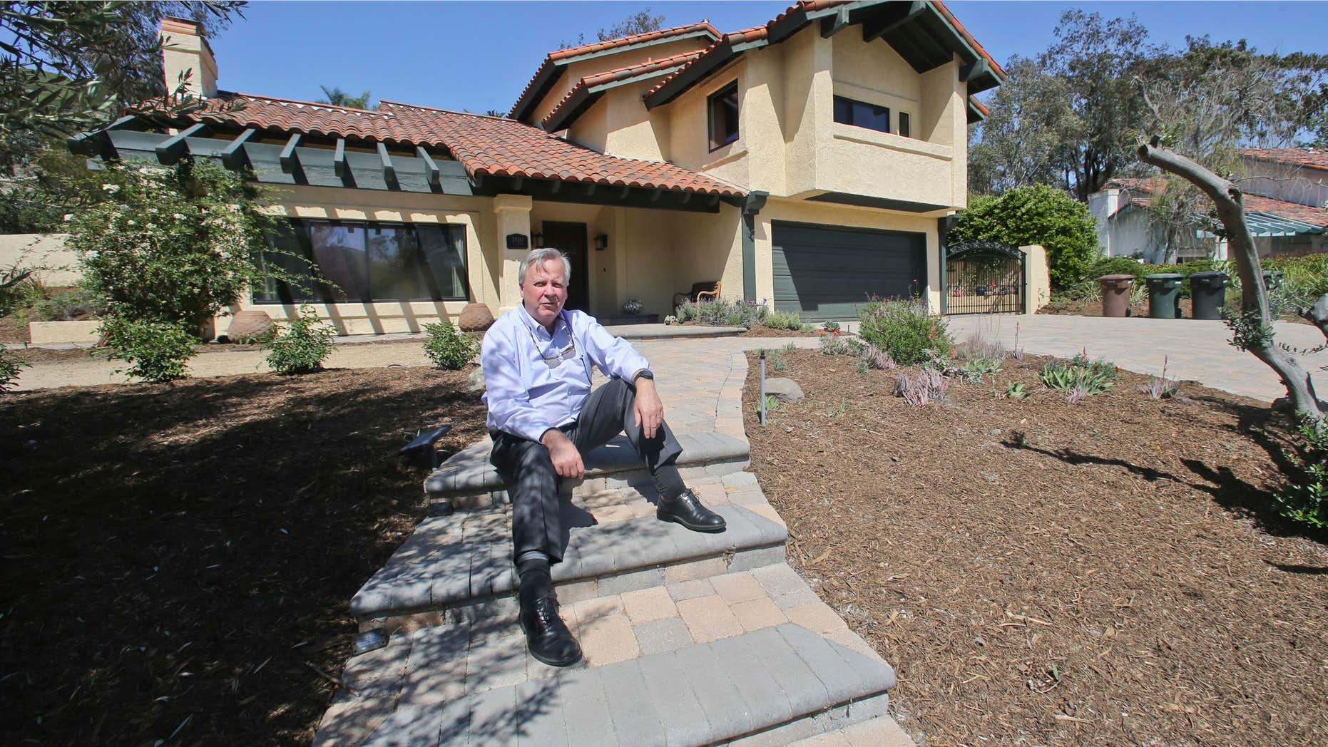 April 17, 2015: Jim Reardon, who is awaiting a ruling from a California appeals court regarding his suit over tiered water rates, stands outside his home where he installed drought-tolerant landscaping in San Juan Capistrano, Calif.