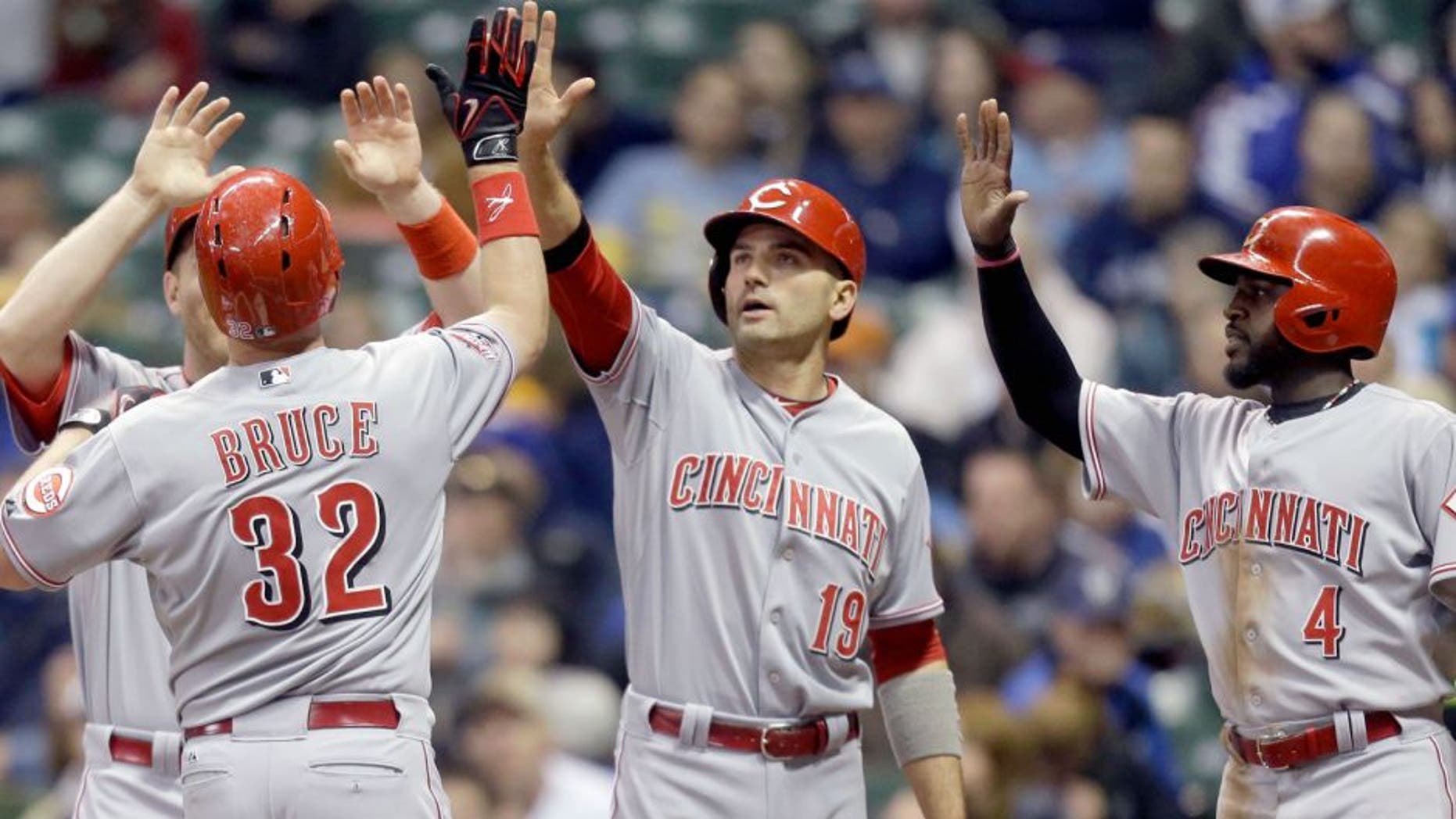 MILWAUKEE, WI - APRIL 21: Jay Bruce #32 of the Cincinnati Reds celebrates with Todd Frazier #21, Joey Votto #19 and Brandon Phillips #4 after hitting a grand slam in the third inning against the Milwaukee Brewers at Miller Park on April 21, 2015 in Milwaukee, Wisconsin. (Photo by Mike McGinnis/Getty Images)