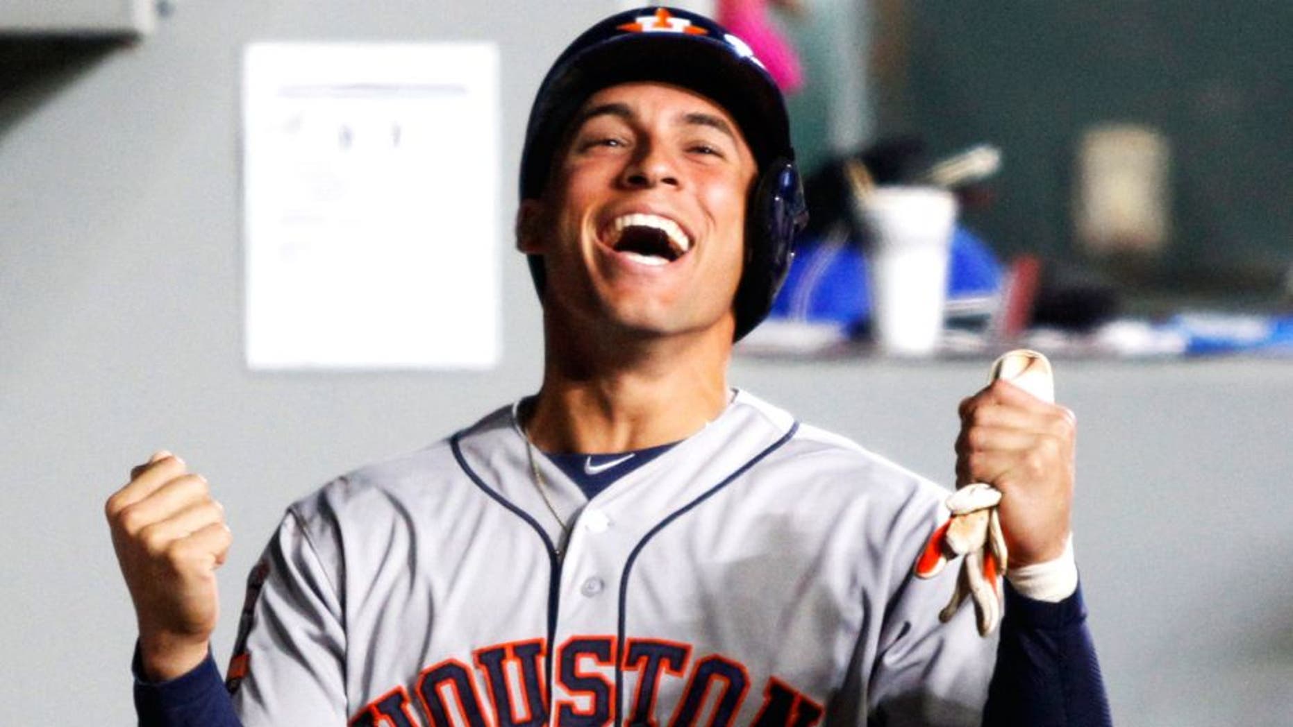 Apr 21, 2015; Seattle, WA, USA; Houston Astros right fielder George Springer (4) celebrates his RBI-sacrifice fly against the Seattle Mariners during the third inning at Safeco Field. Mandatory Credit: Joe Nicholson-USA TODAY Sports
