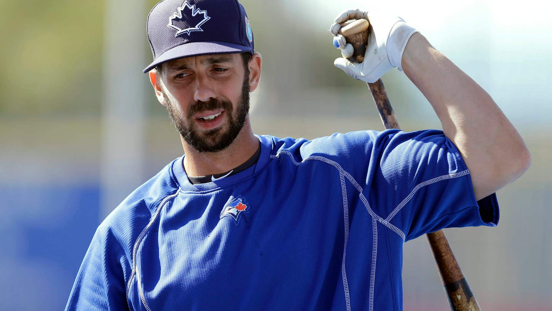 FILE - In this March 23, 2016, file photo, Toronto Blue Jays' Chris Colabello loosens up before a spring training baseball game against the New York Mets in Dunedin, Fla.