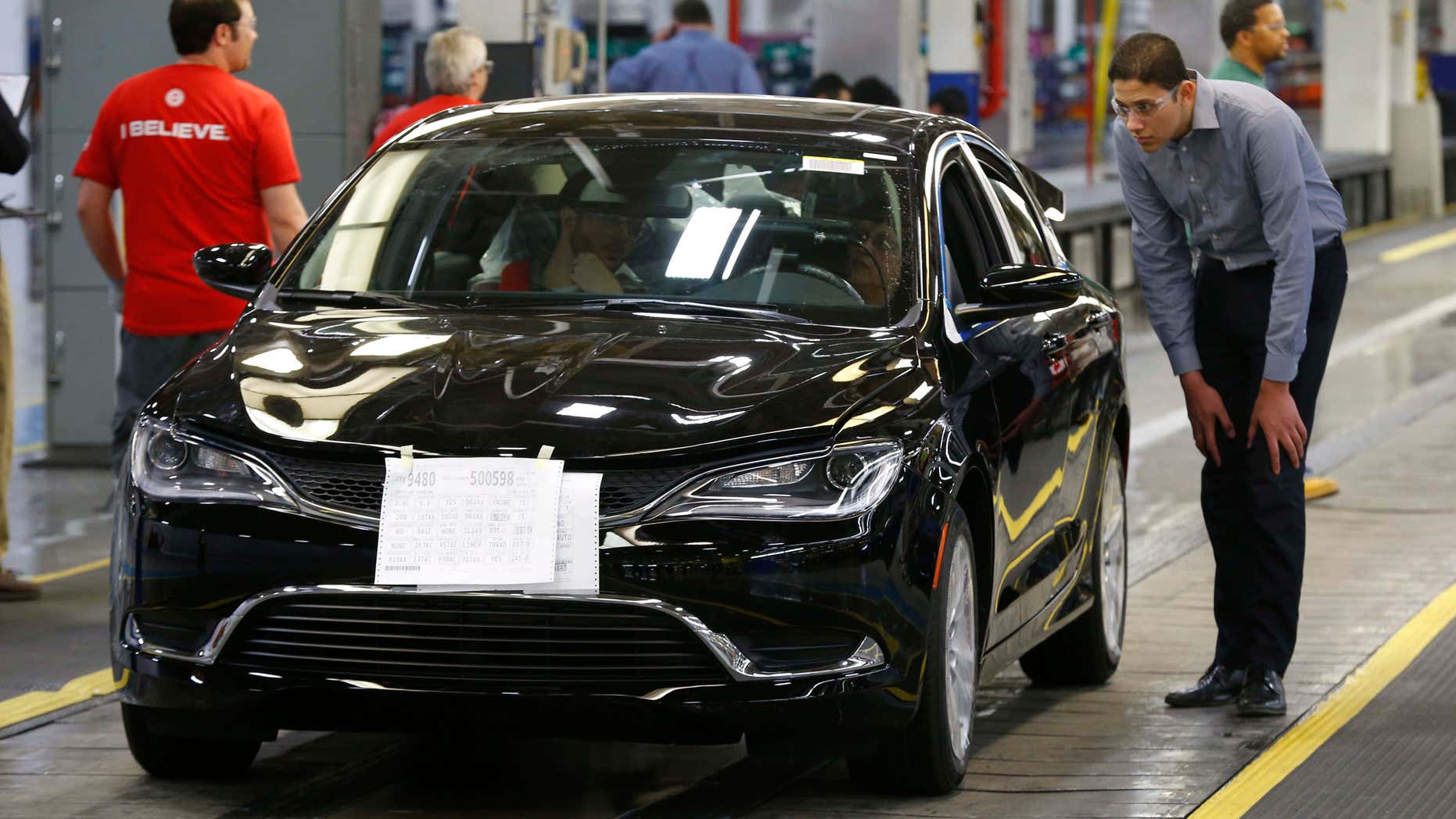 FILE - In this March 14, 2014 file photo, a 2015 Chrysler 200 automobile rolls down the assembly line at the Sterling Heights Assembly Plant in Sterling Heights, Mich.